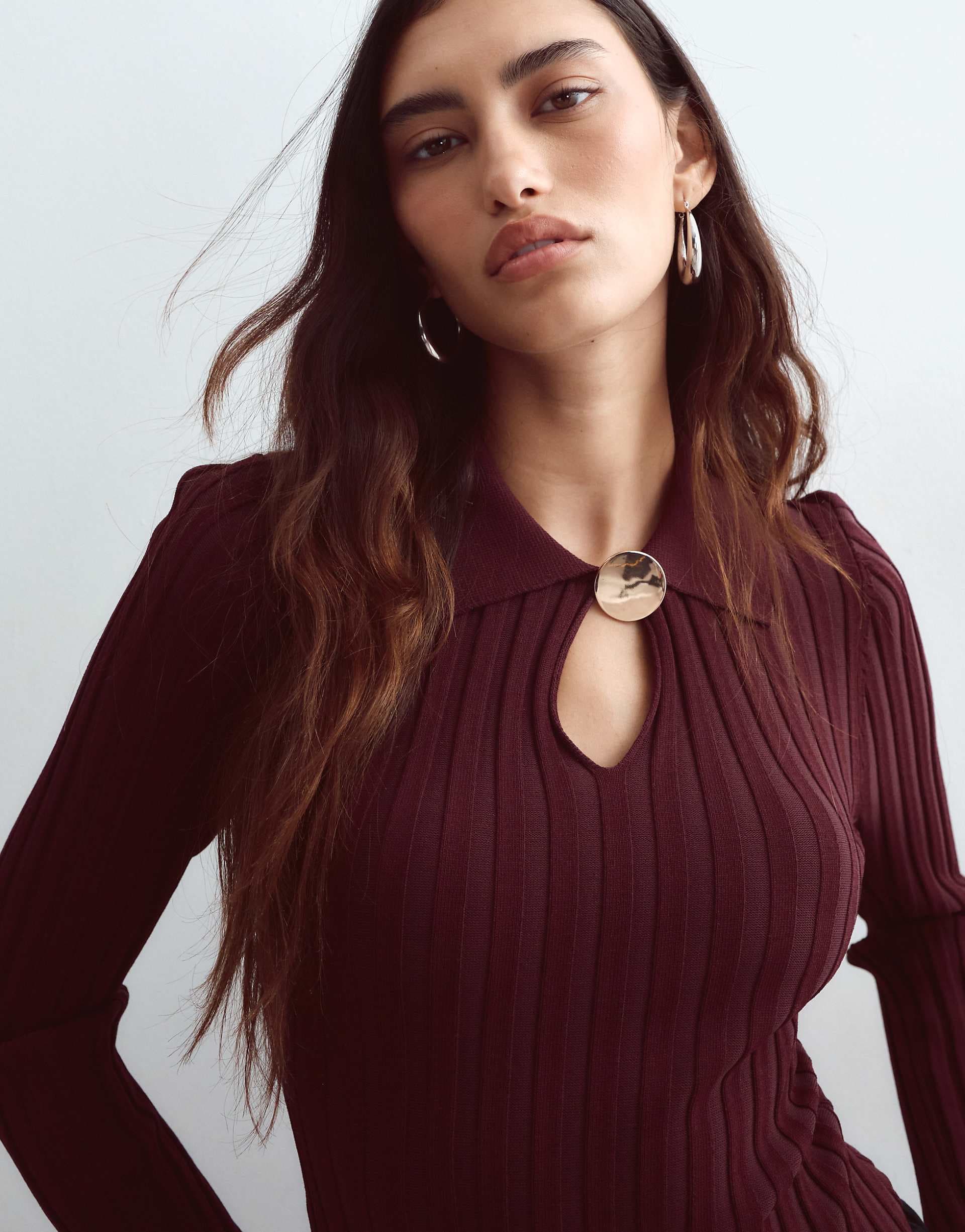 ARRANGE knit ribbed bodysuit with oversized button in burgundy