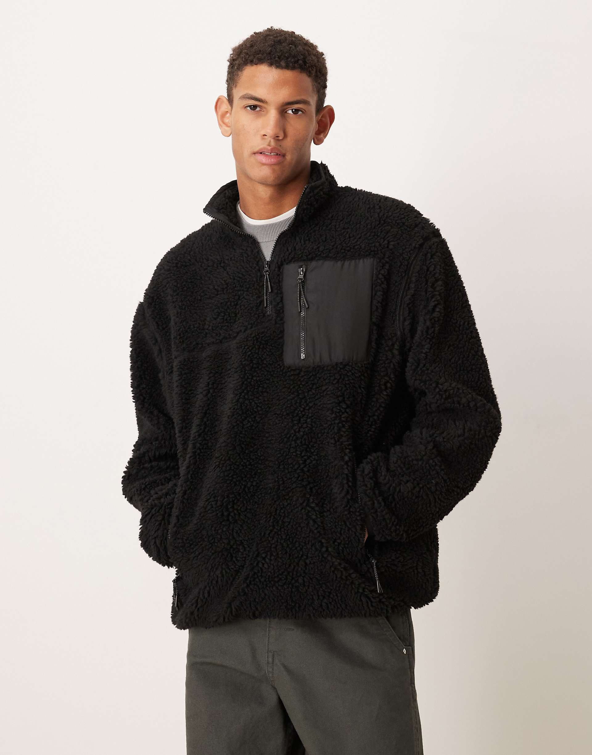 ASOS DESIGN relaxed teddy quarter zip sweatshirt with pocket in black