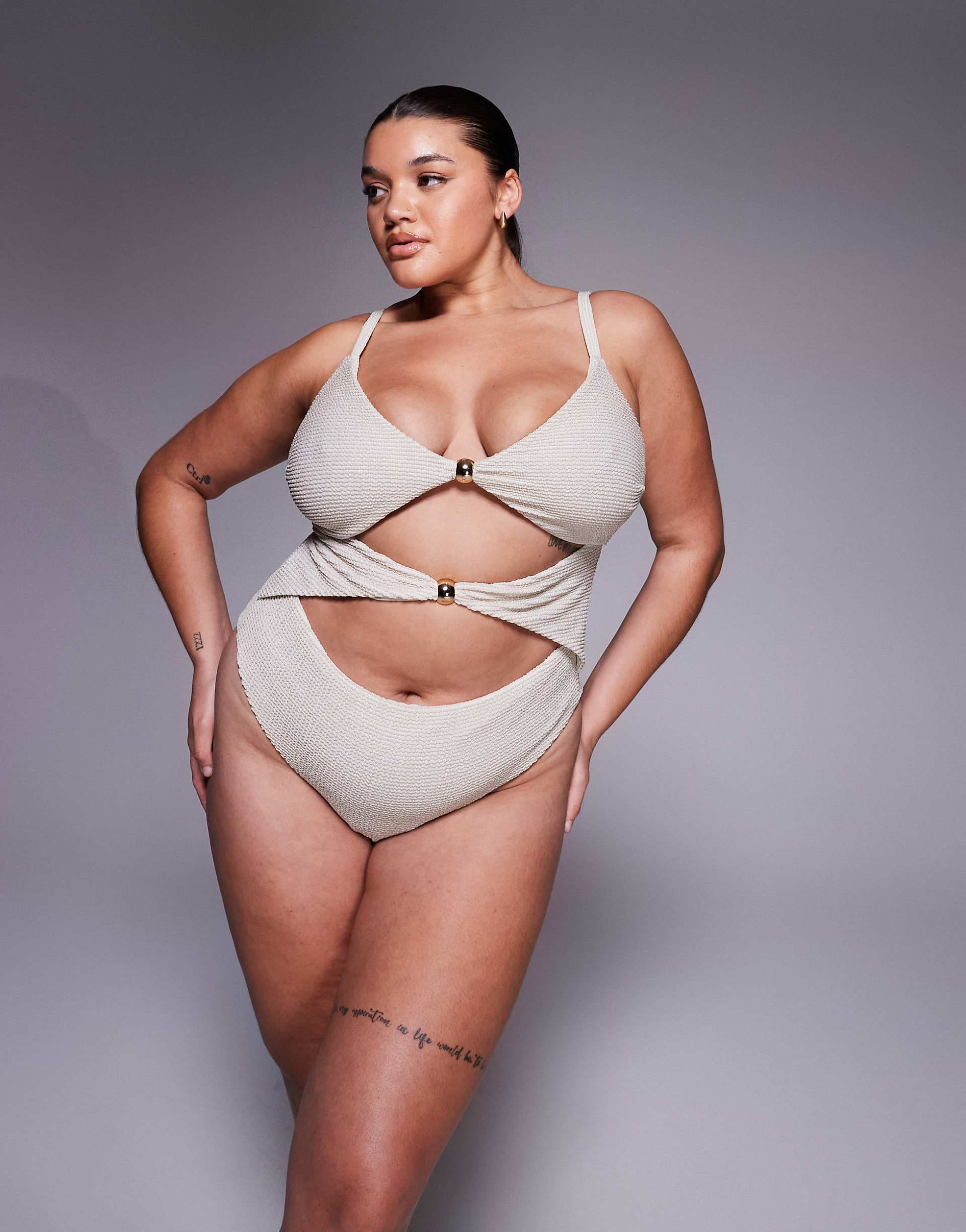ASOS DESIGN Curve Winter crinkle cut out swimsuit with hardware in metallic cream