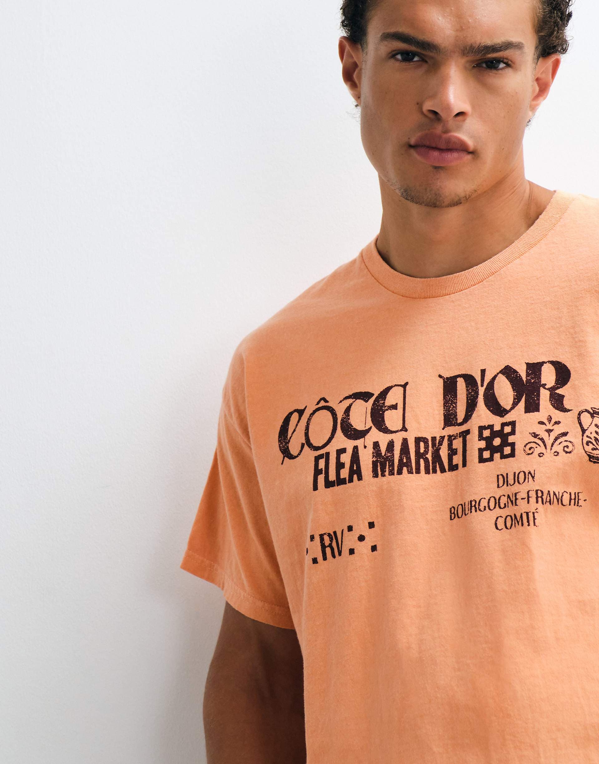 Reclaimed Vintage Unisex jersey tee with flea market print in orange