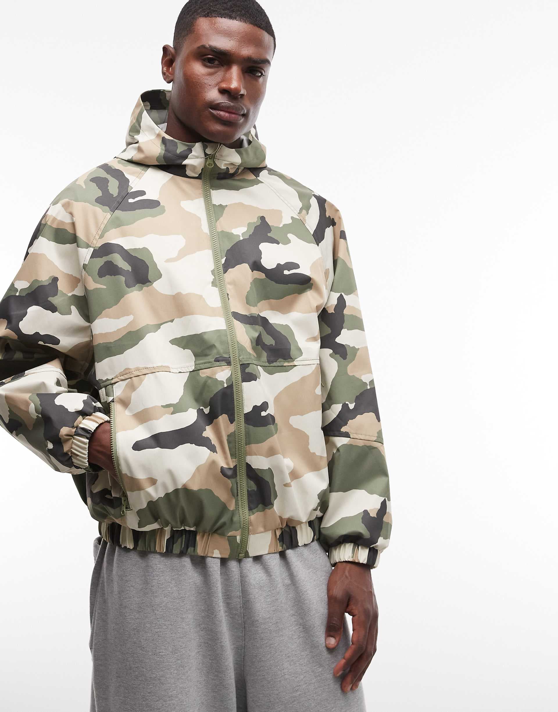 ASOS DESIGN stormMAX™ waterproof packaway rain jacket in camo