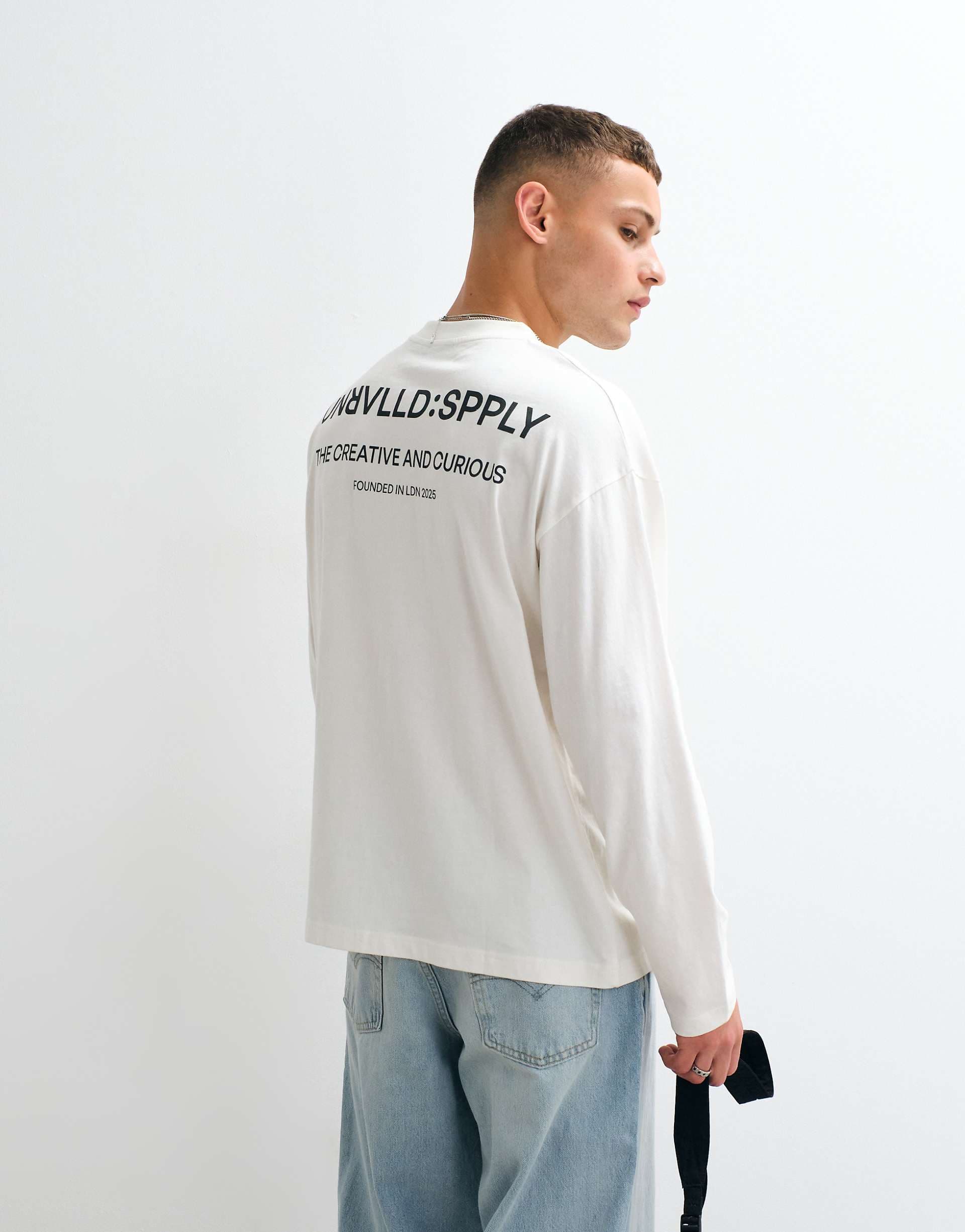 ASOS DESIGN oversized long sleeve t-shirt with text graphic in cream
