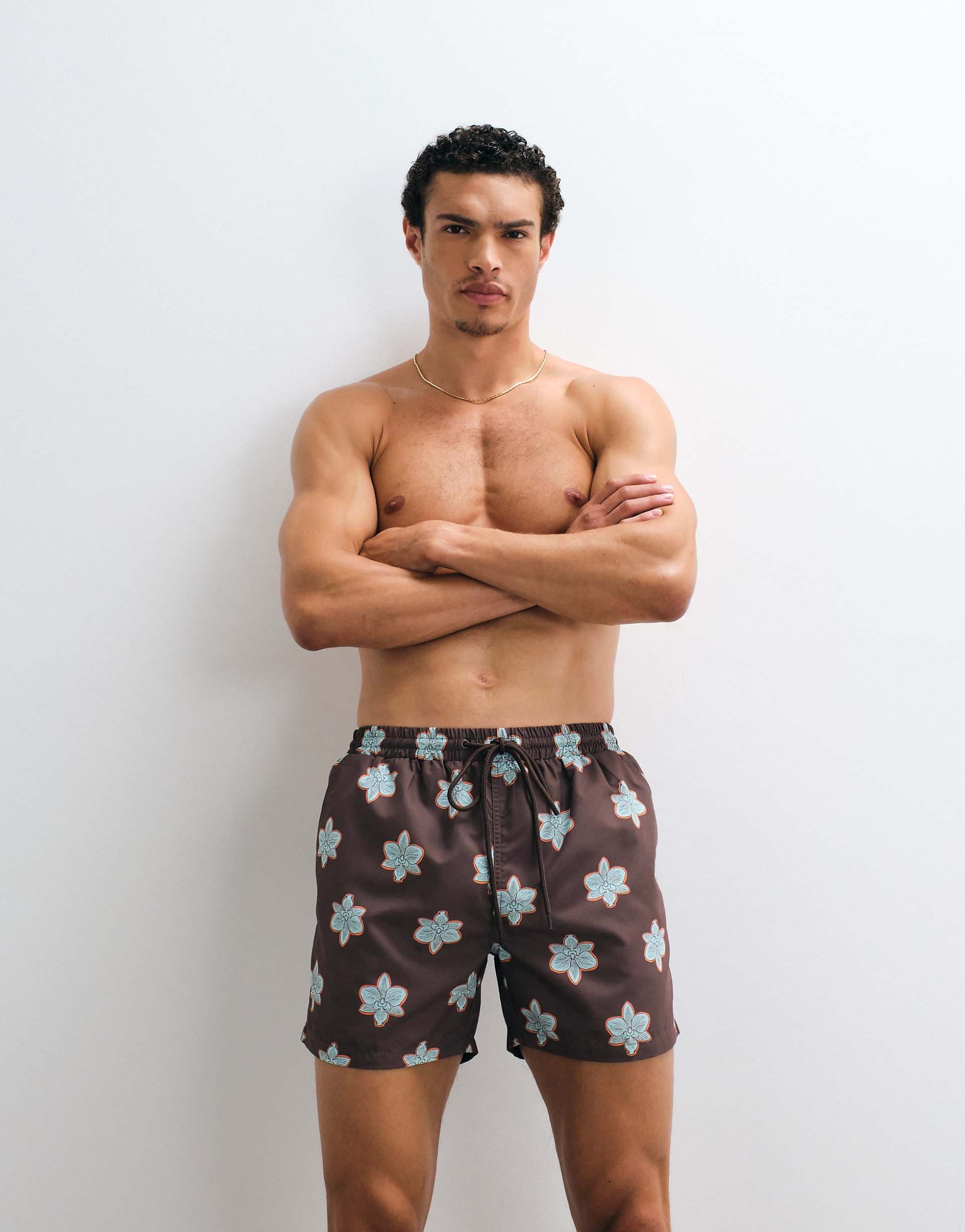 South Beach flower motif swim shorts in dark brown