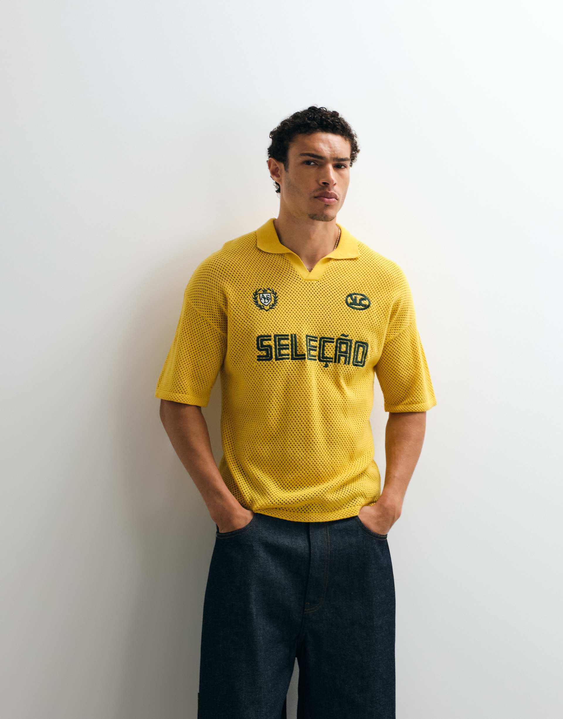 ASOS DESIGN relaxed knit soccer‑style notch neck polo shirt with embroidery in yellow