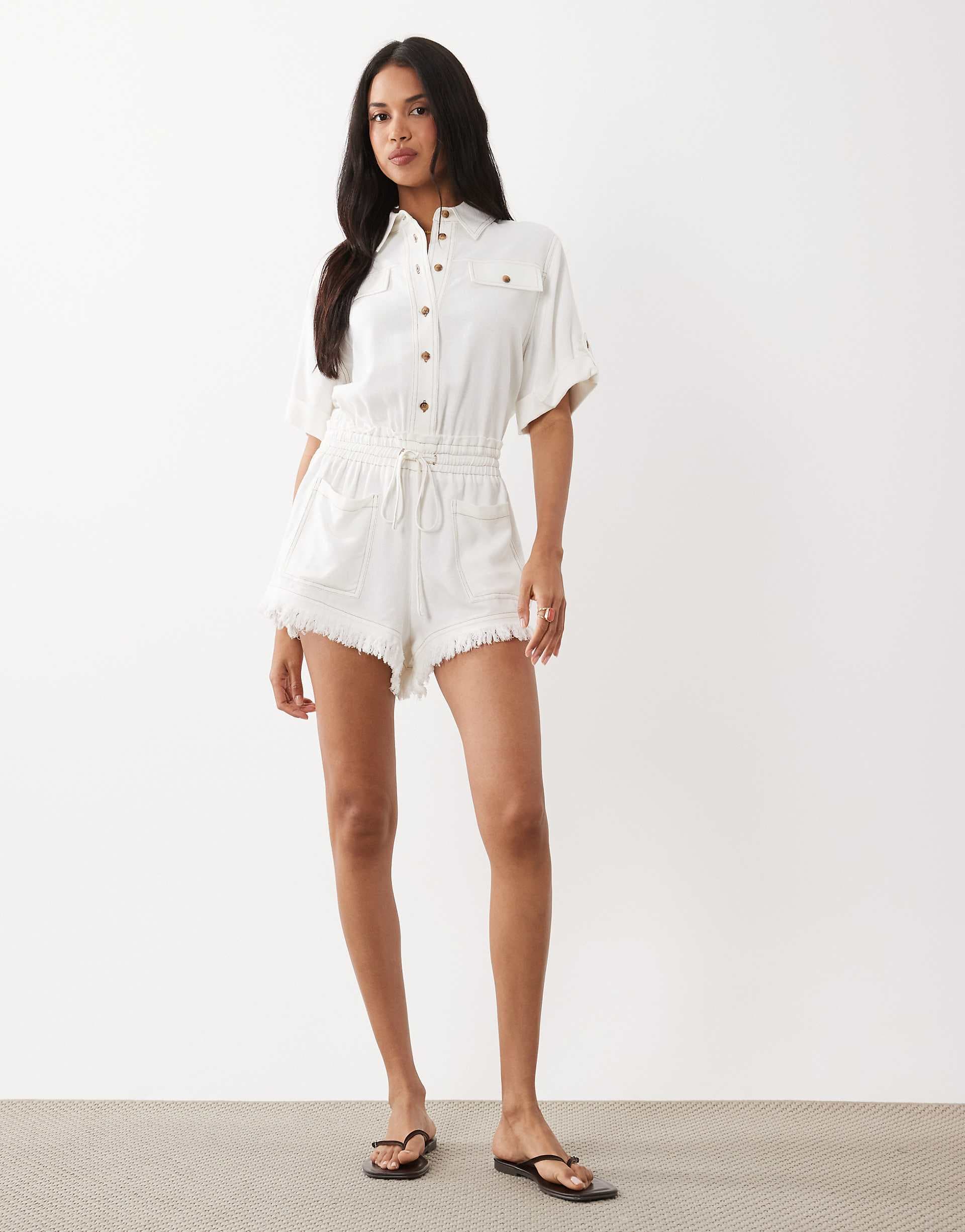 Noughts & Kisses cotton rich dropped shoulder frayed shorts detailing romper in white