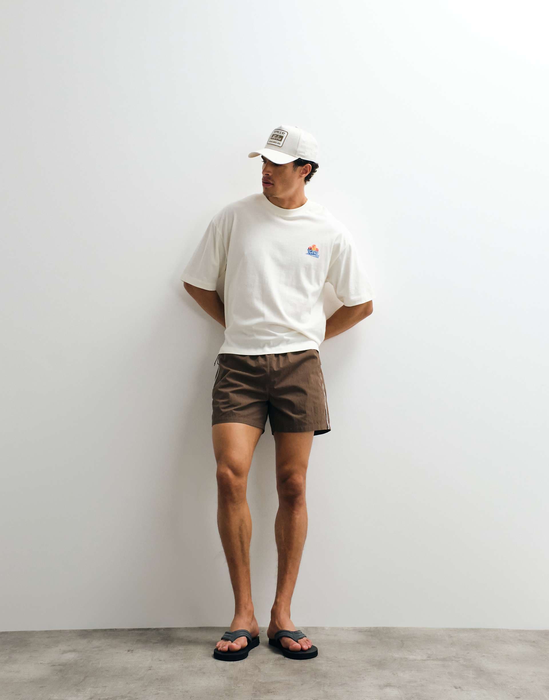 ASOS DESIGN wide leg mid length elasticized nylon shorts with piping in brown