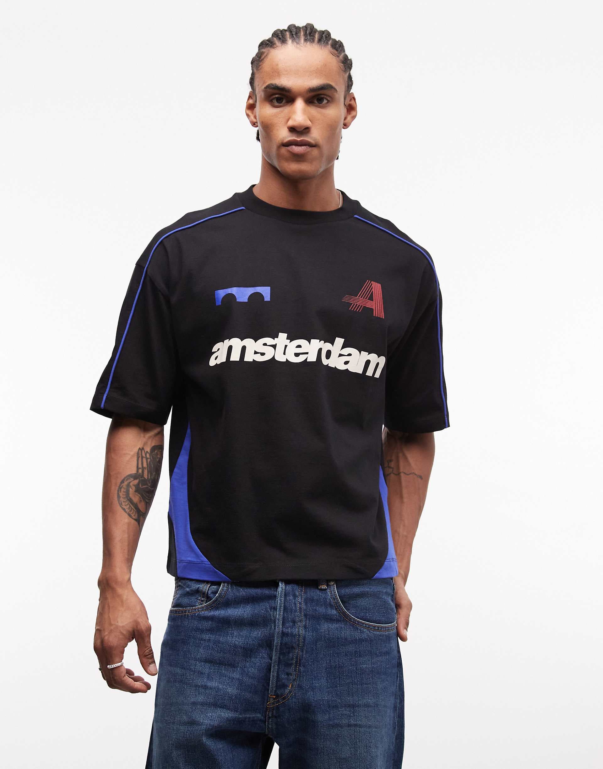 ASOS DESIGN boxy oversized t-shirt with cut and sew paneling and sports graphics in black
