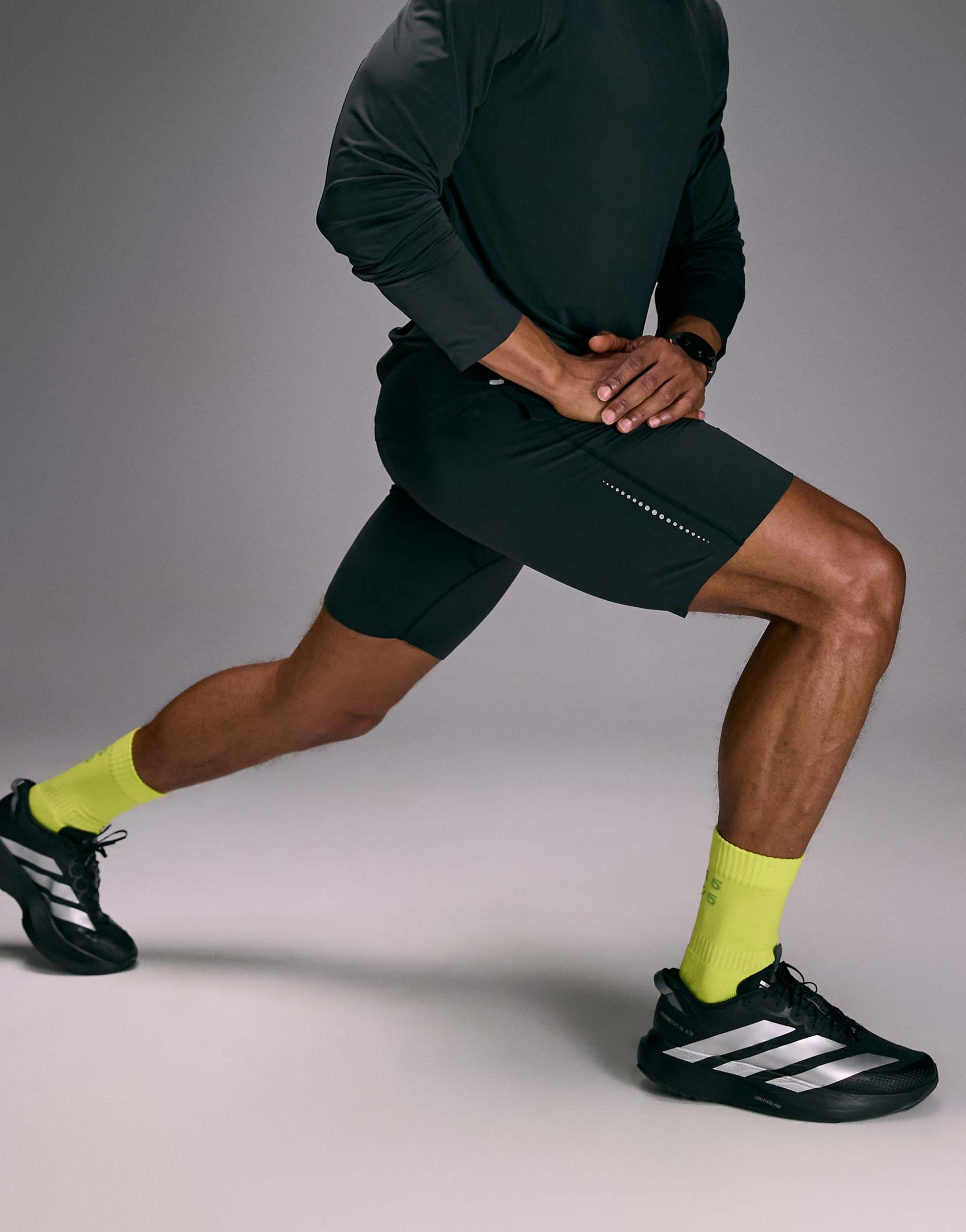 4505 Premium reflective running half tights with phone pocket and bonded hems in void black