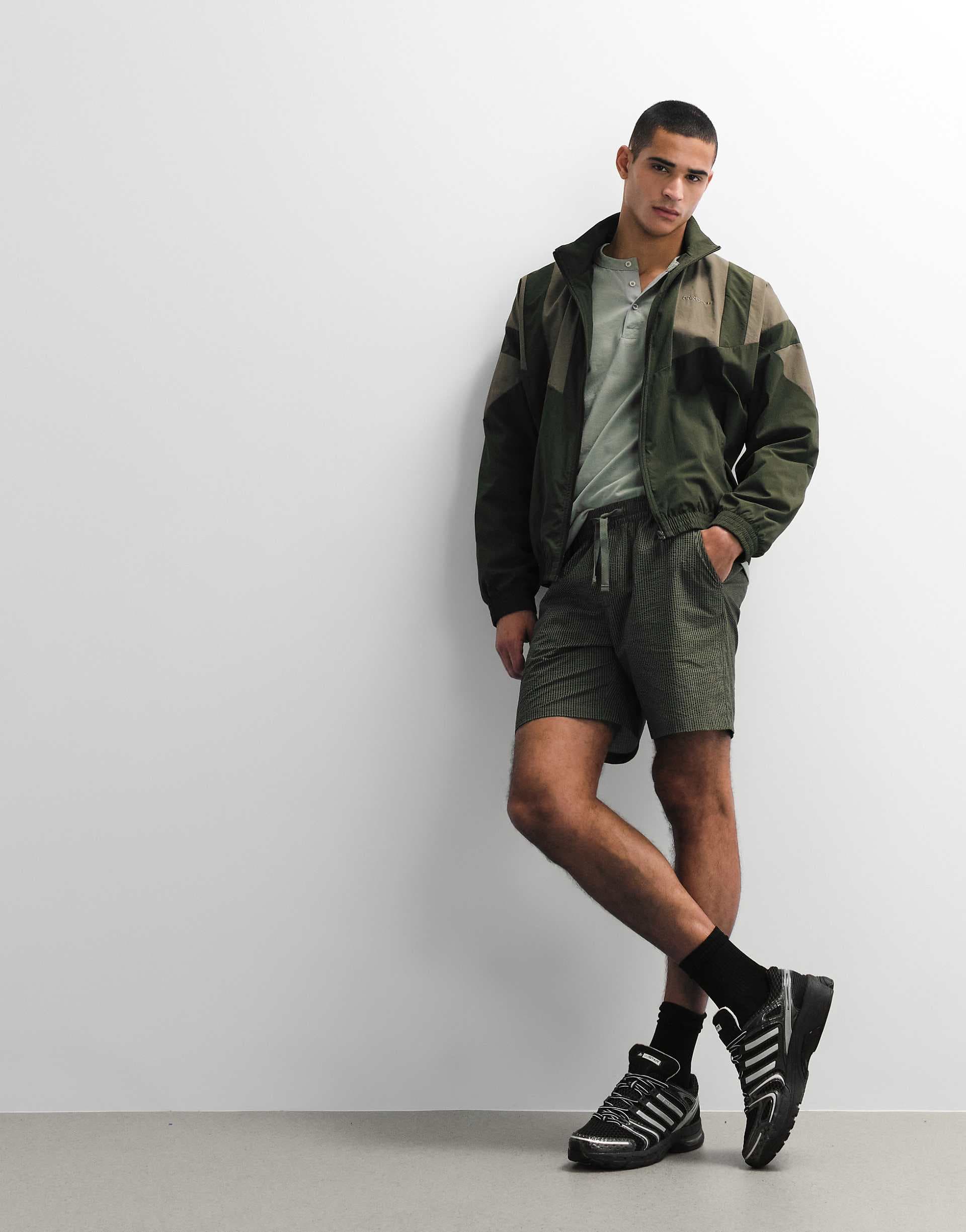 ASOS DESIGN slim mid length elastic shorts in khaki striped seersucker