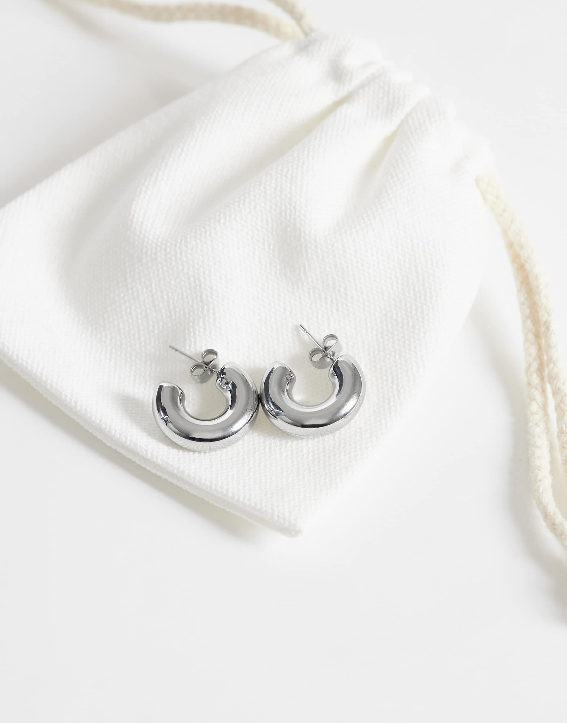 ASOS DESIGN waterproof stainless steel small chubby hoop earrings in silver tone with gift bag