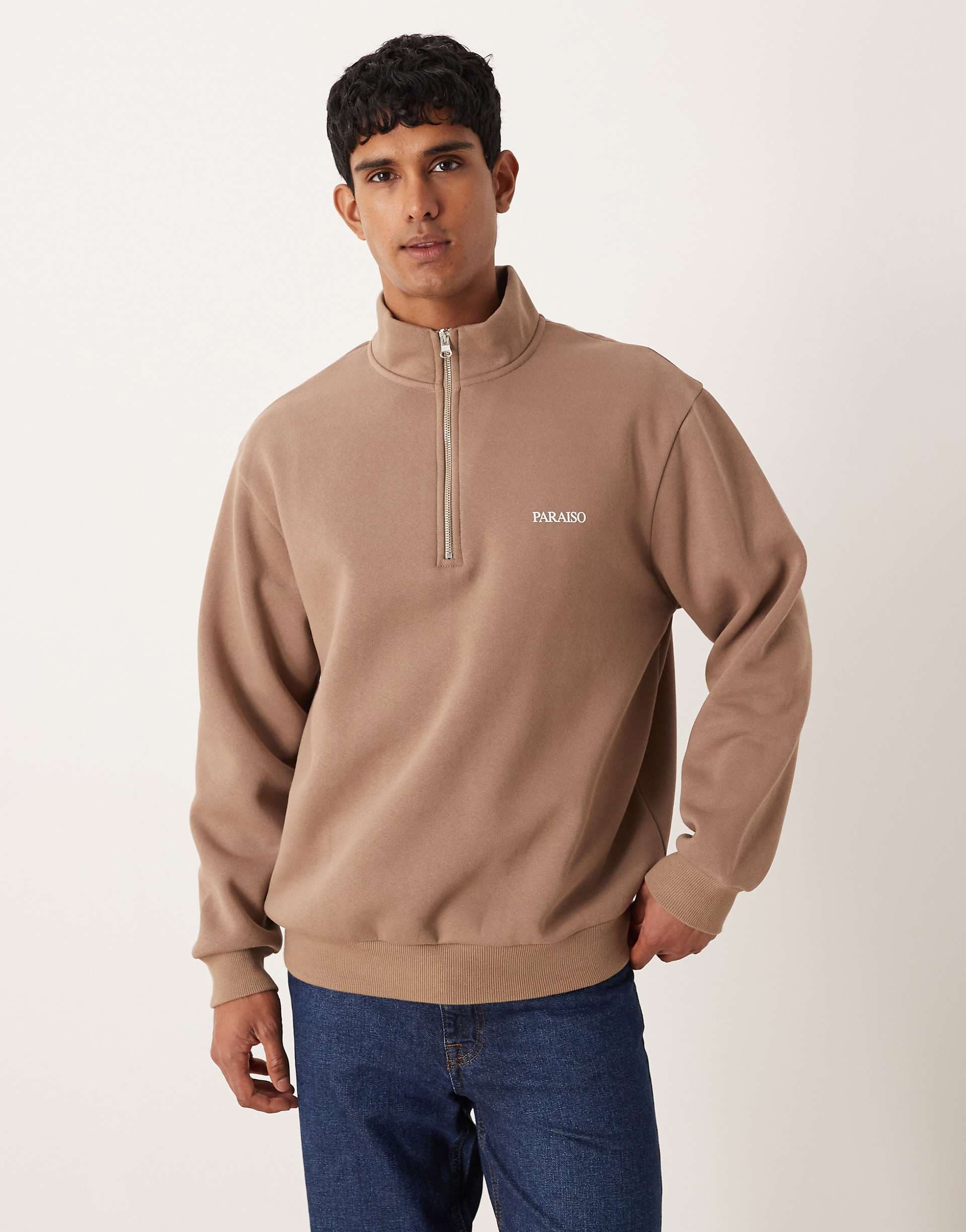 ASOS DESIGN relaxed quarter zip sweatshirt with text chest print in brown