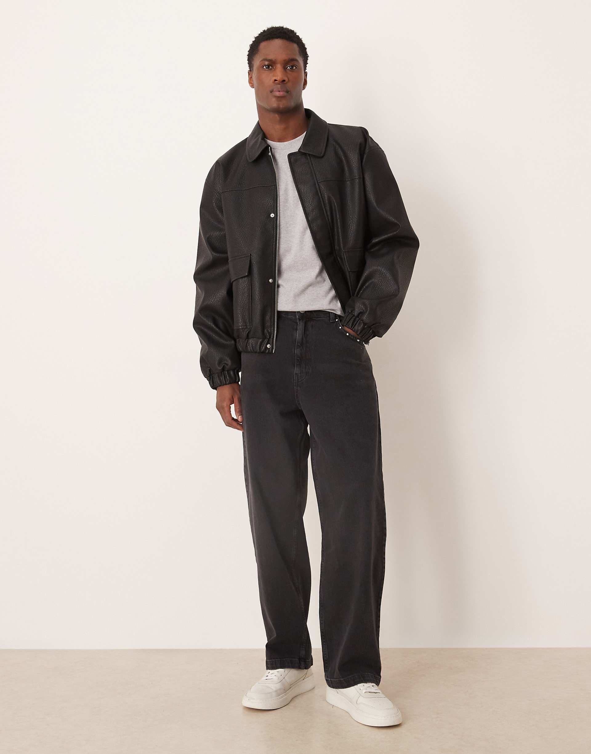 ASOS DESIGN loose straight fit jeans with stud detail in black wash
