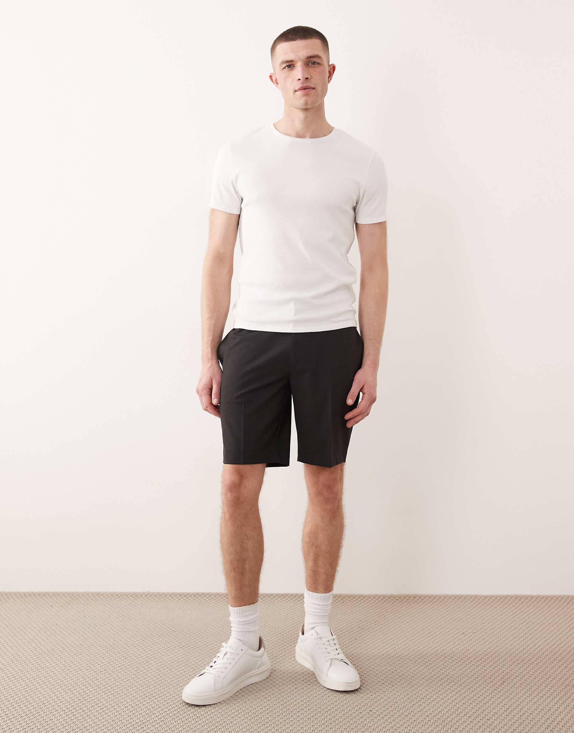 ASOS DESIGN tailored comfort stretch slim shorts in charcoal with elastic waist