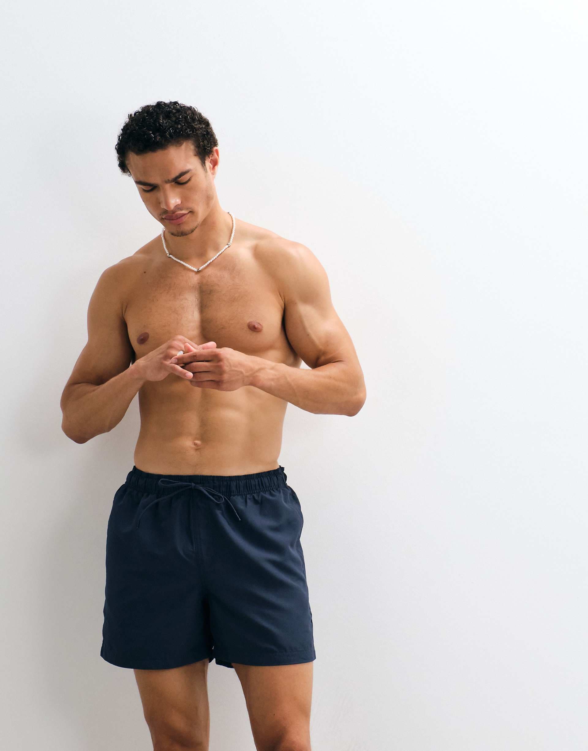 Jack & Jones mid length swim shorts in navy