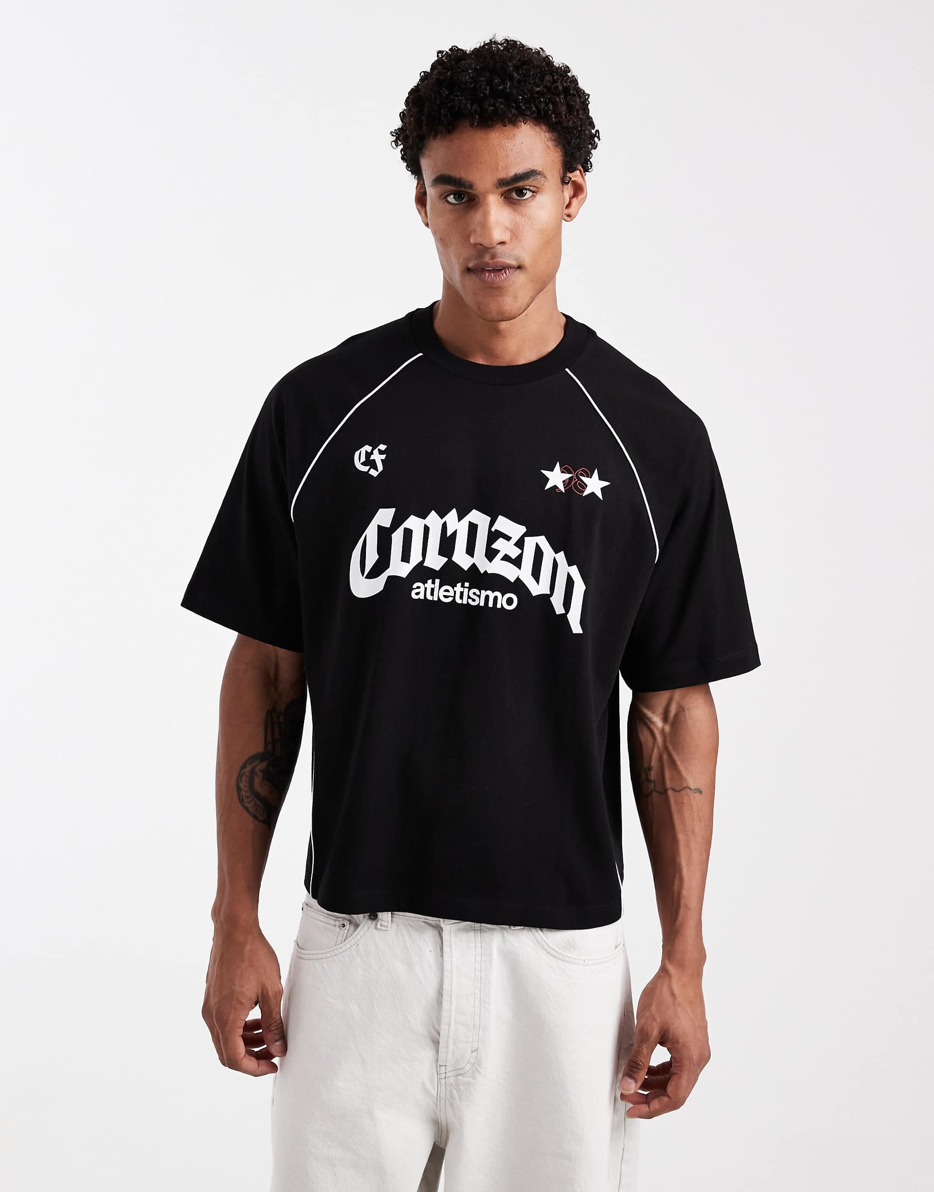 ASOS DESIGN boxy oversized T-shirt with soccer graphic in black