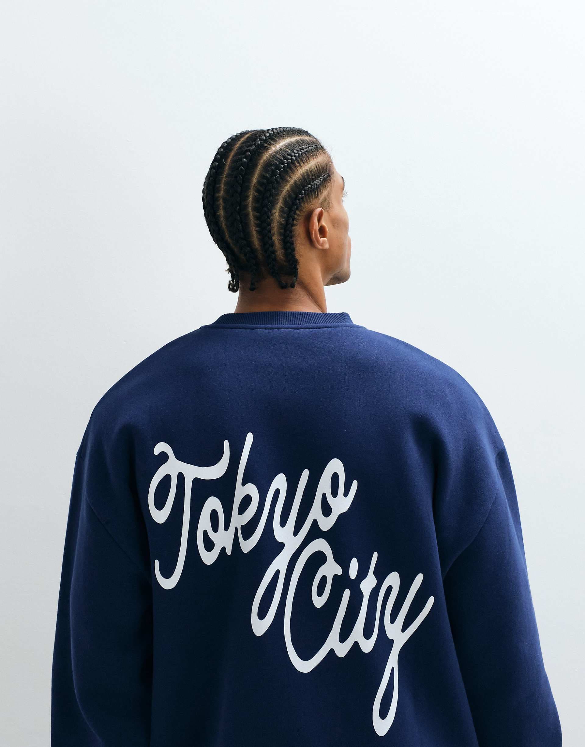 ASOS DESIGN oversized sweatshirt with tokyo print in navy