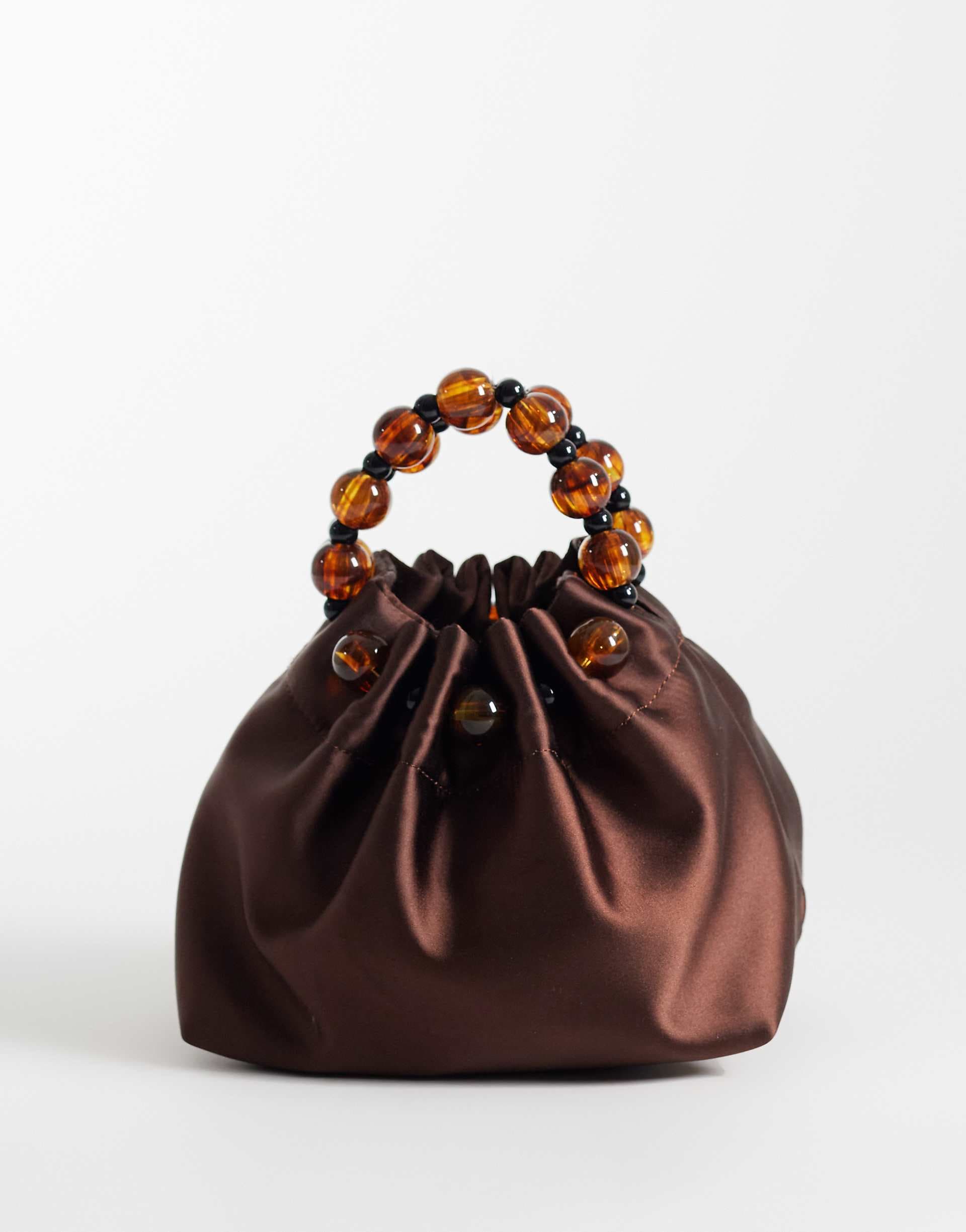 ASOS DESIGN ruched clutch with resin beads in brown satin