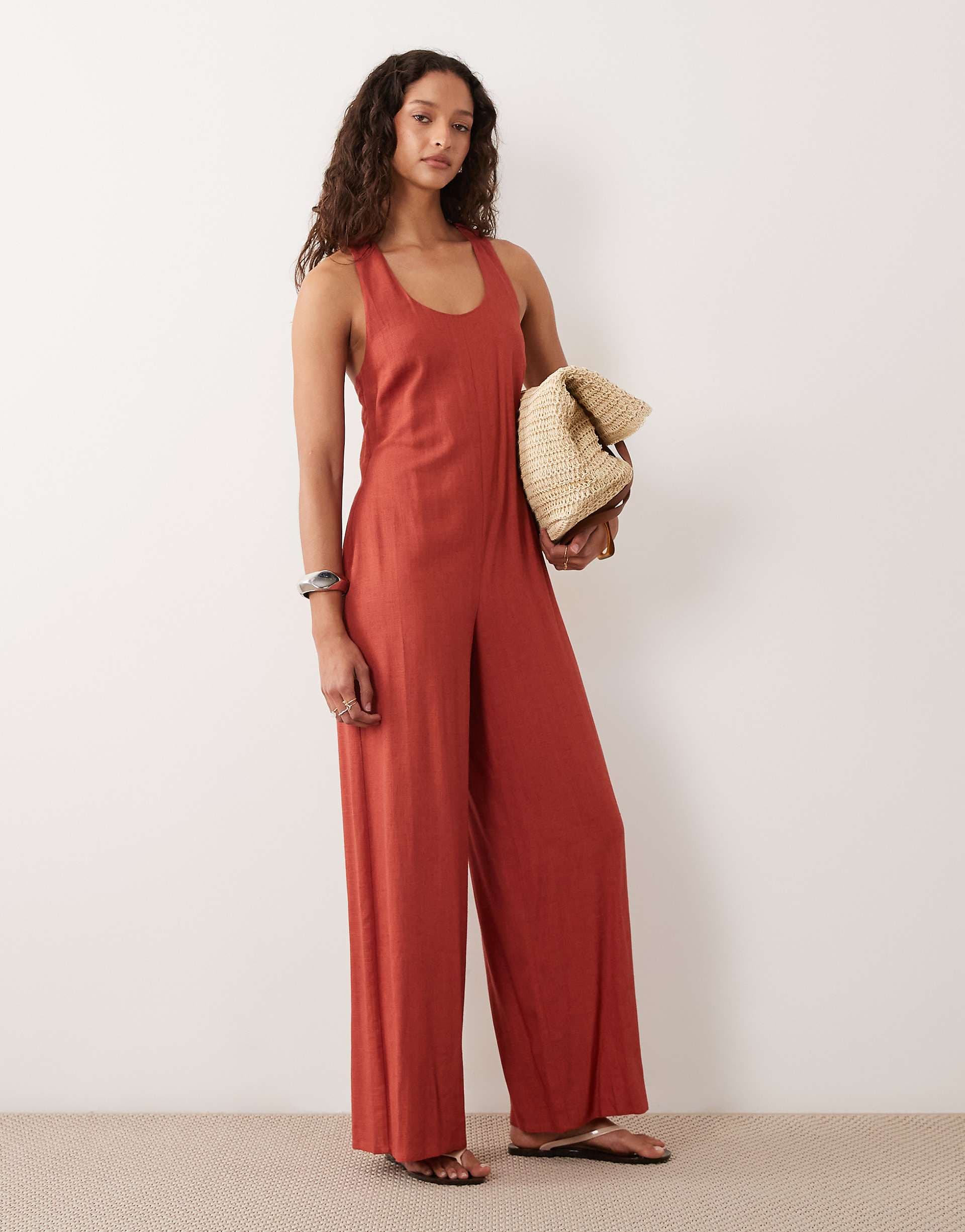 ASOS DESIGN wide leg jumpsuit with twist back in rust