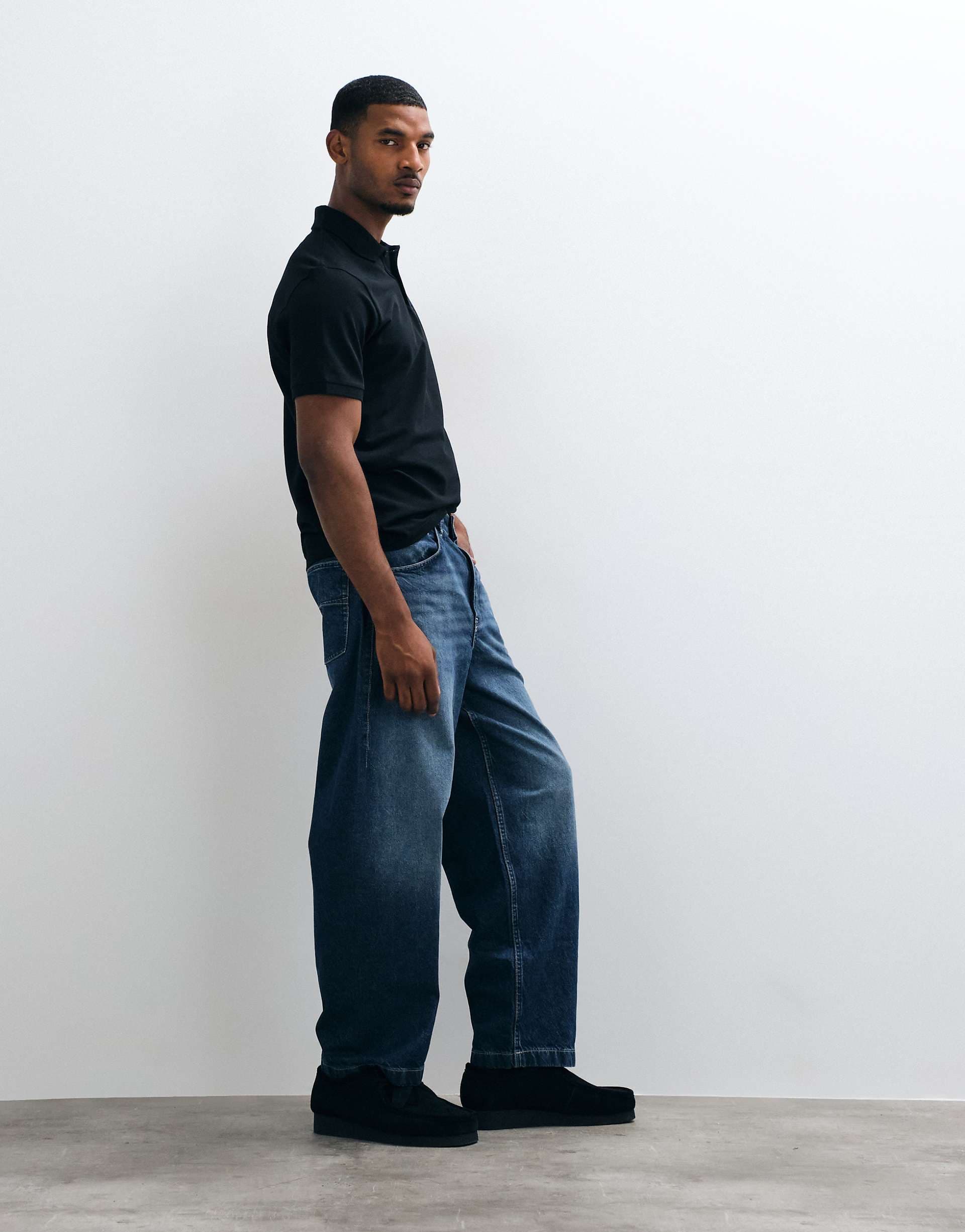 ASOS DESIGN loose jeans in dark wash blue with pleats and buckle