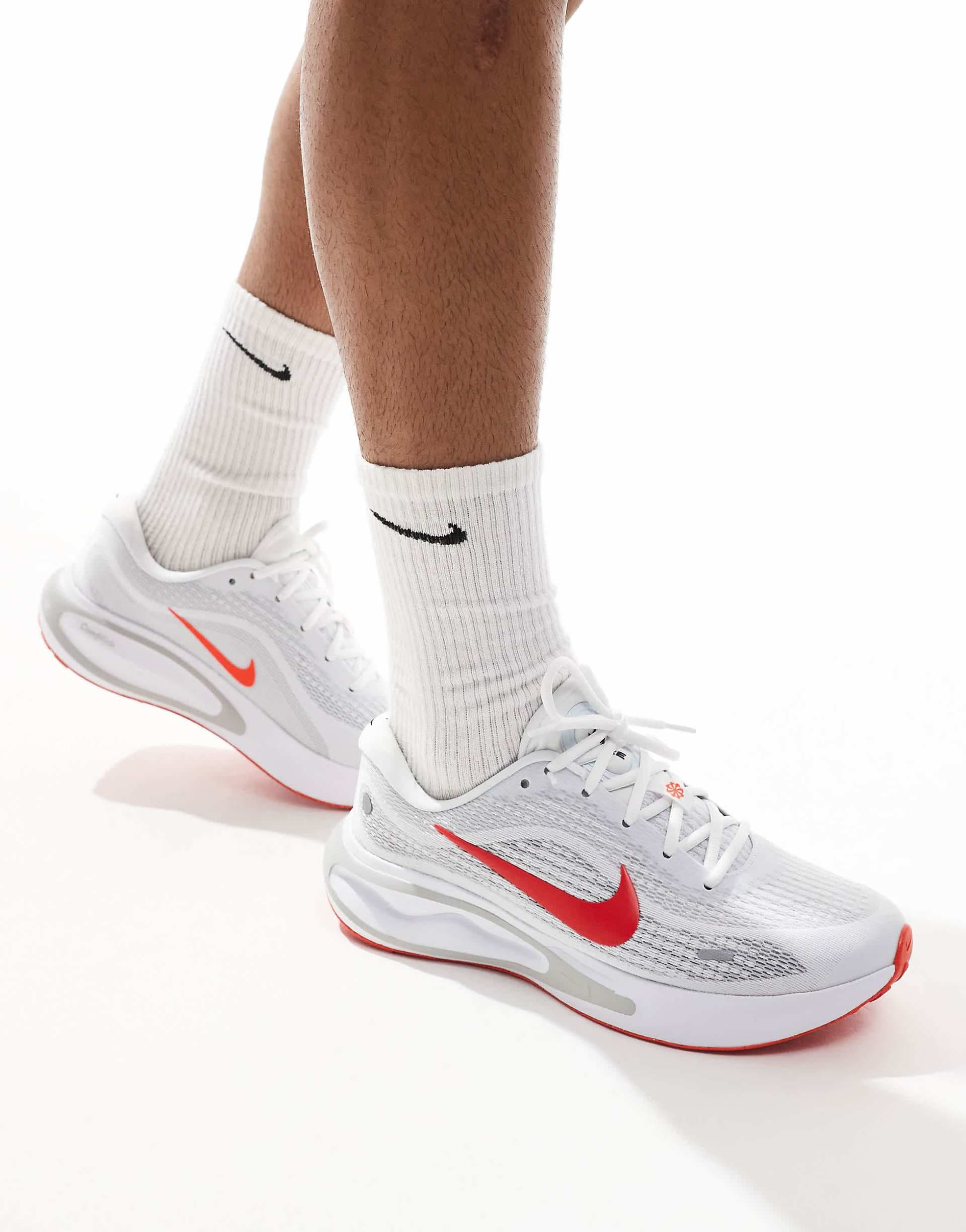 Nike Running Journey Run sneakers in white and red