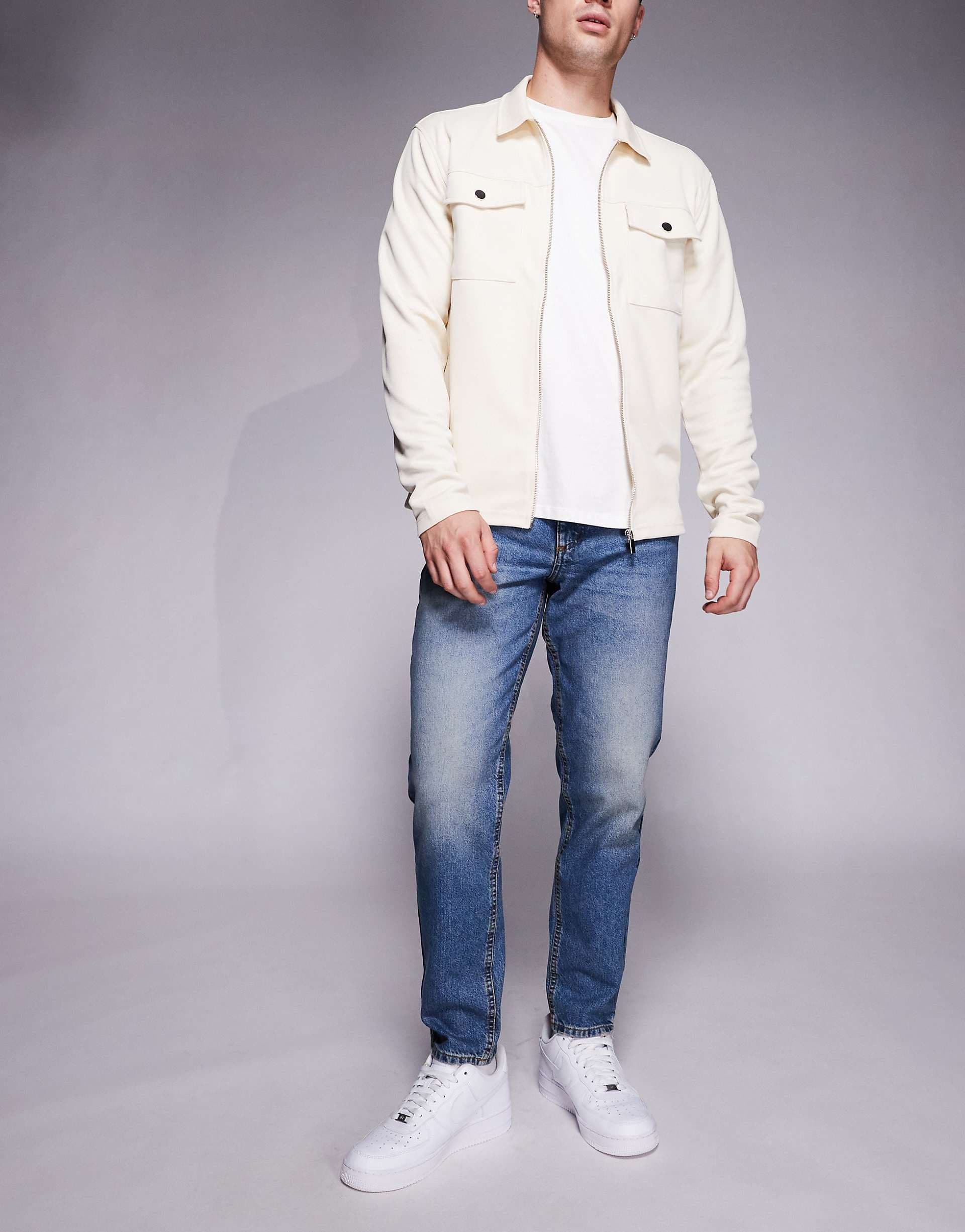 ASOS DESIGN tapered jeans in mid wash blue tint