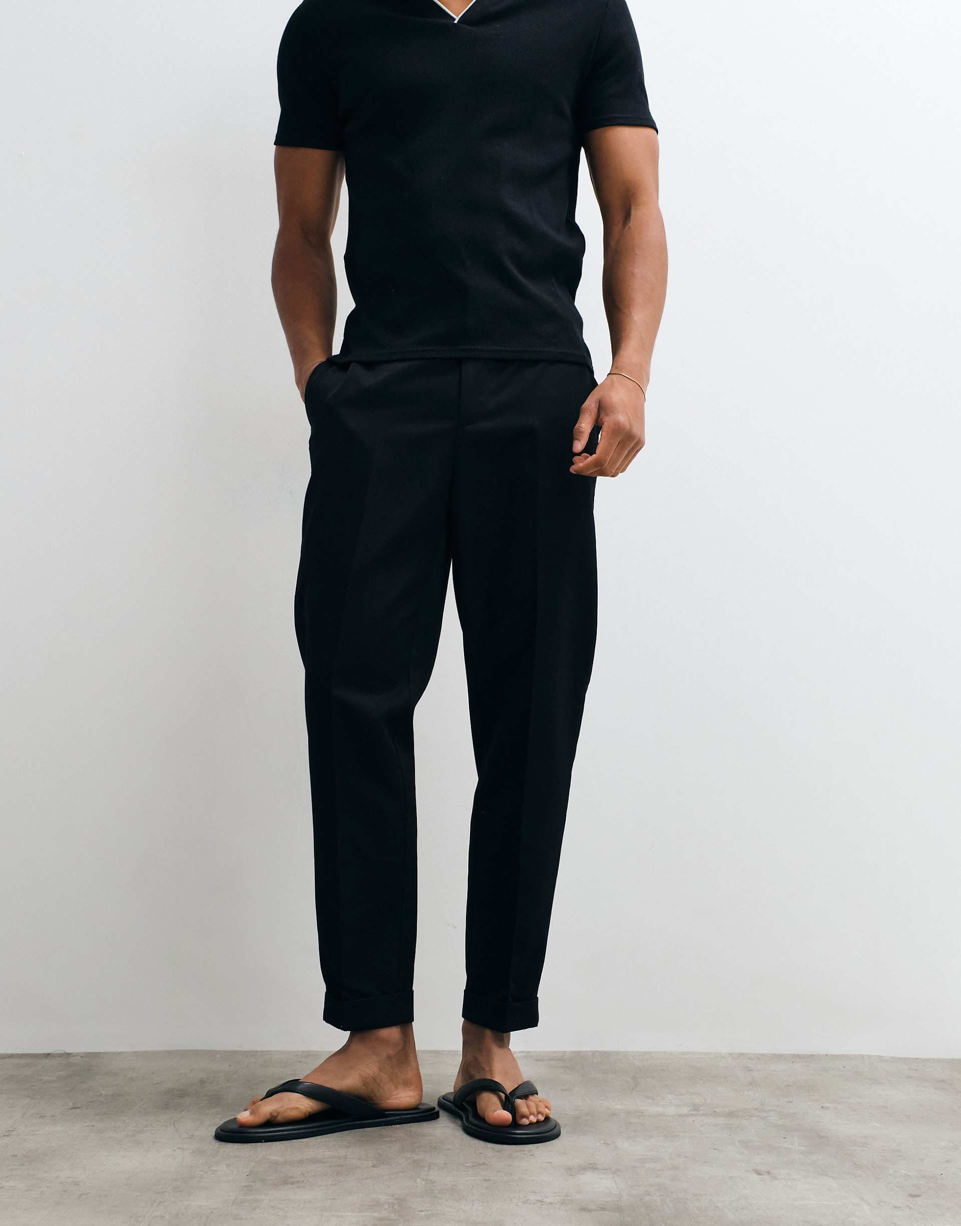 ASOS DESIGN tailored tapered pants in black with elastic waist and rolled cuffs