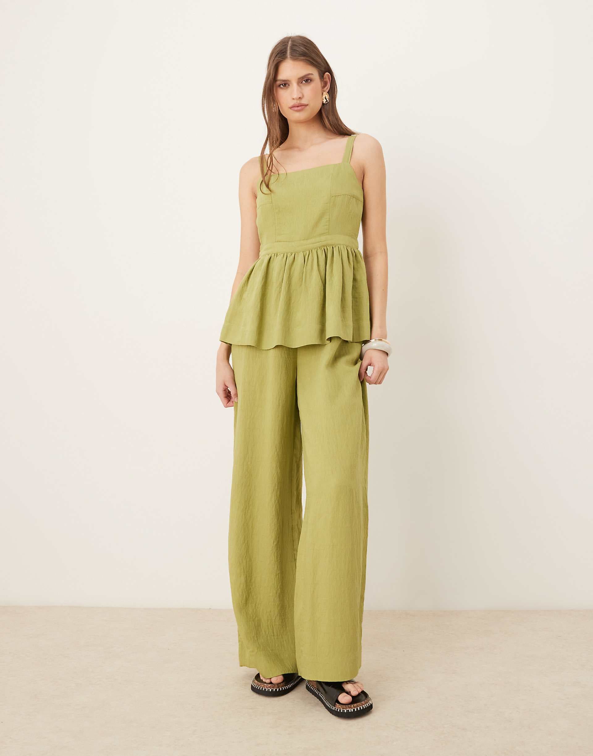 ASOS DESIGN jumpsuit with peplum waist in olive green