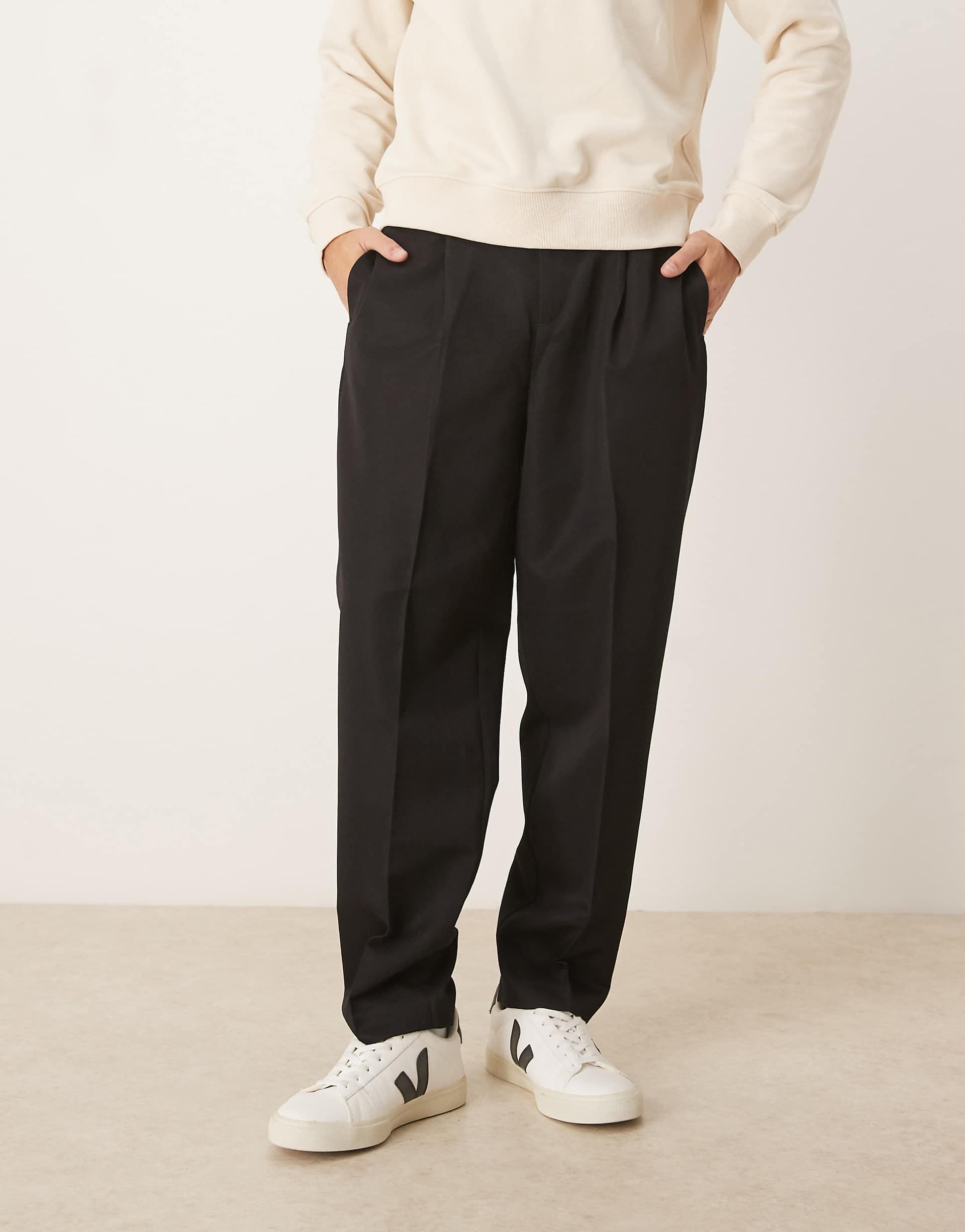 ASOS DESIGN tailored pleated relaxed tapered pants with elastic waistband in black