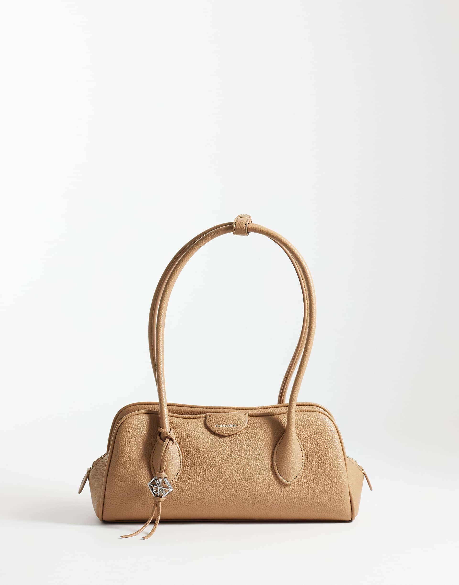 Calvin Klein emblem grain texture shoulder bag with hardware charm in tan