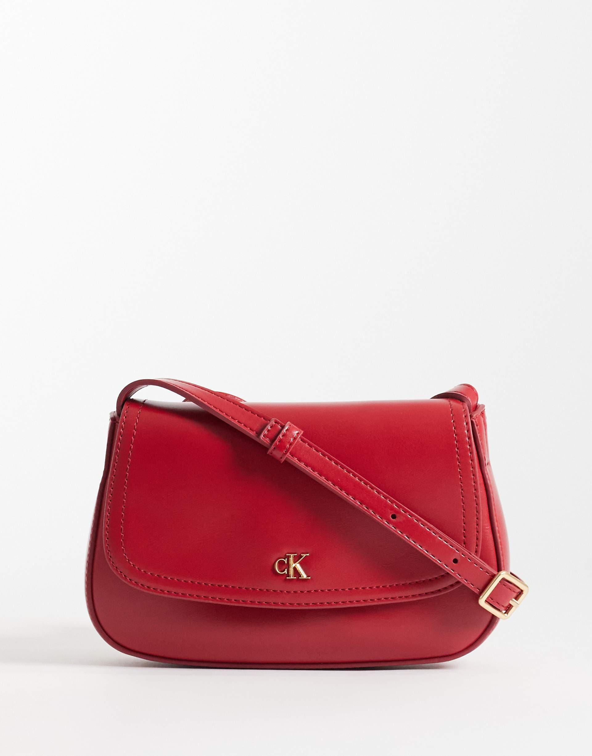 Calvin Klein camera bag with strap and gold detail in red