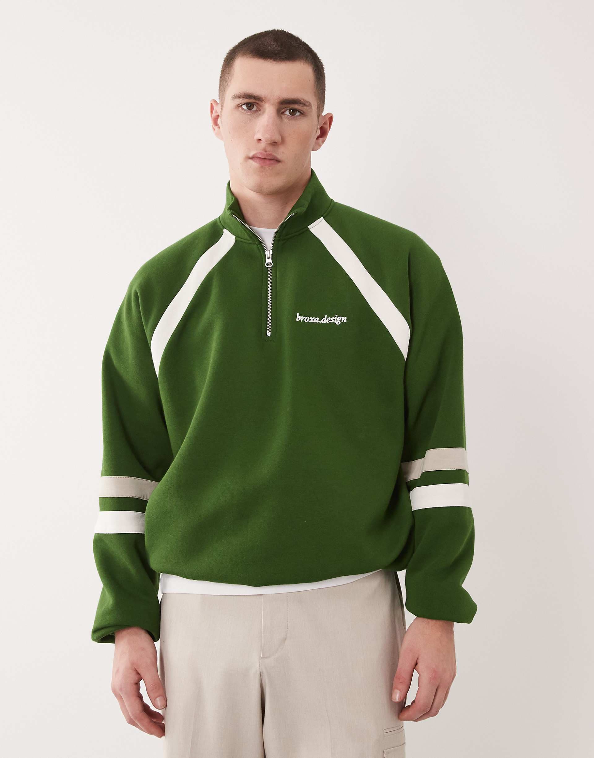 ASOS DESIGN relaxed quarter zip sweatshirt with cut & sew details in green