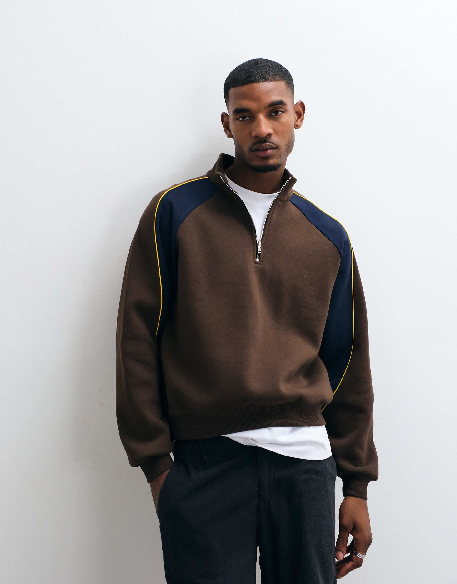 ASOS DESIGN relaxed quarter zip with cut & sew paneling and contrast piping in brown
