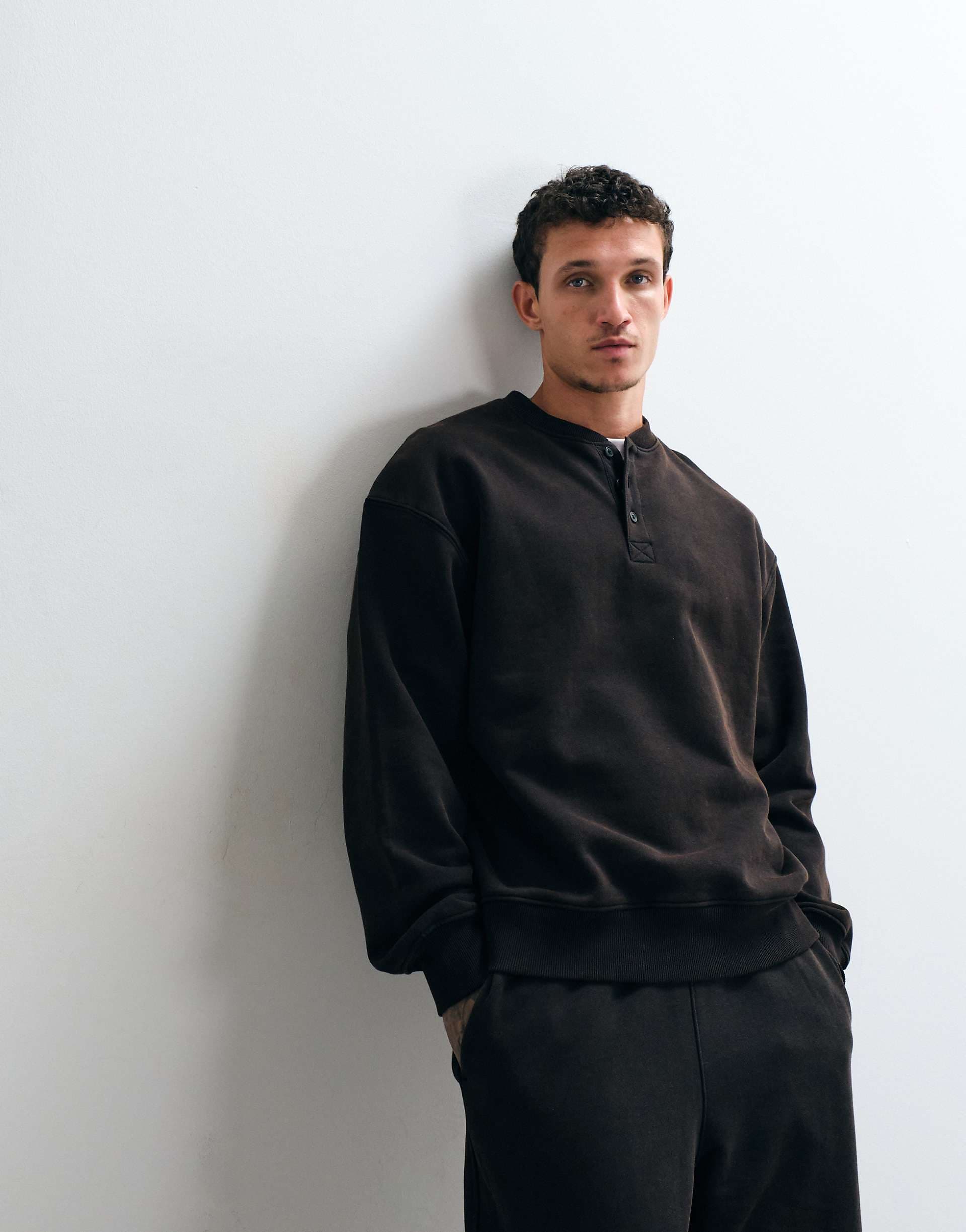 ASOS DESIGN premium heavyweight oversized washed henley sweatshirt in Black