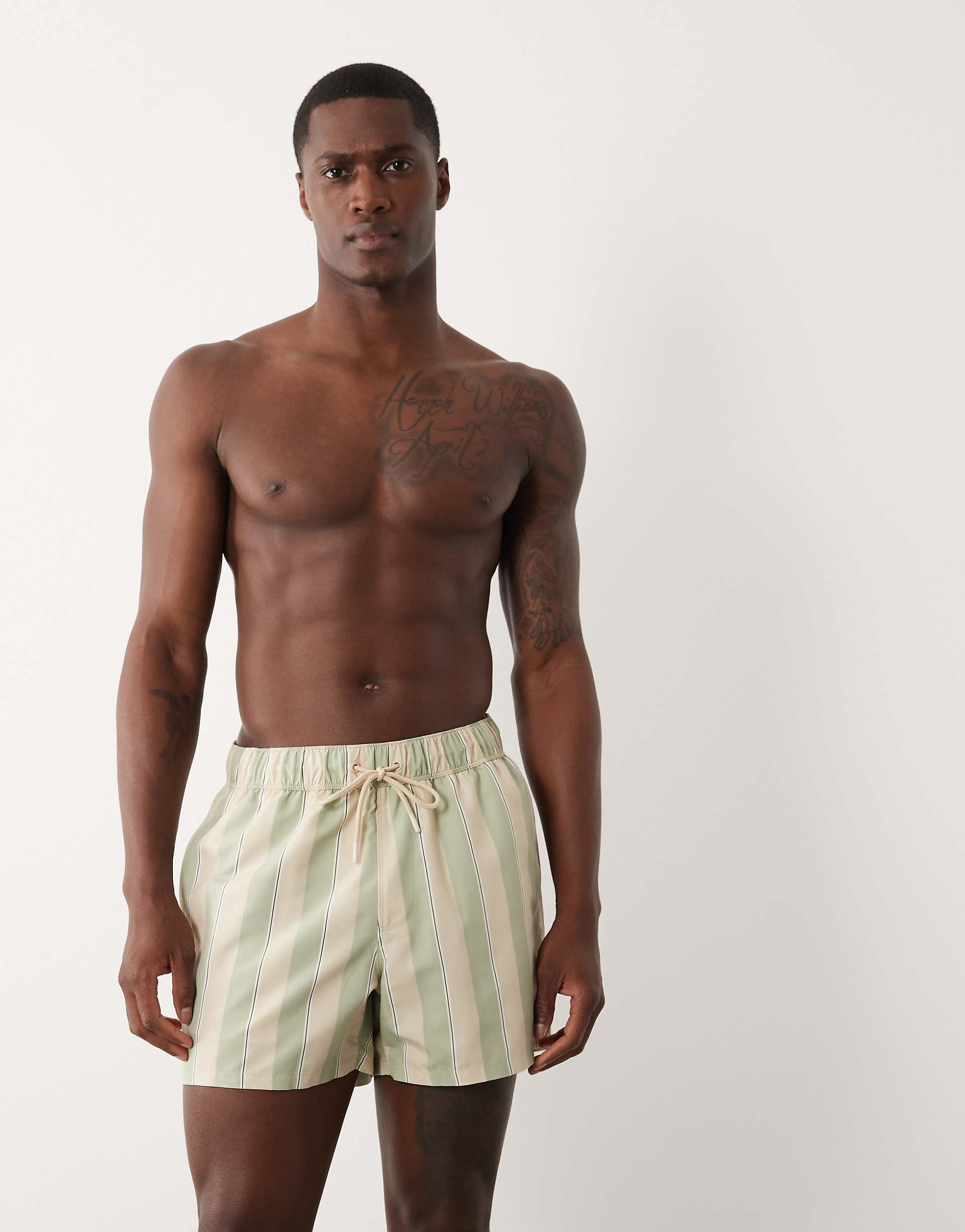 ASOS DESIGN swim shorts in short length in sage green stripes