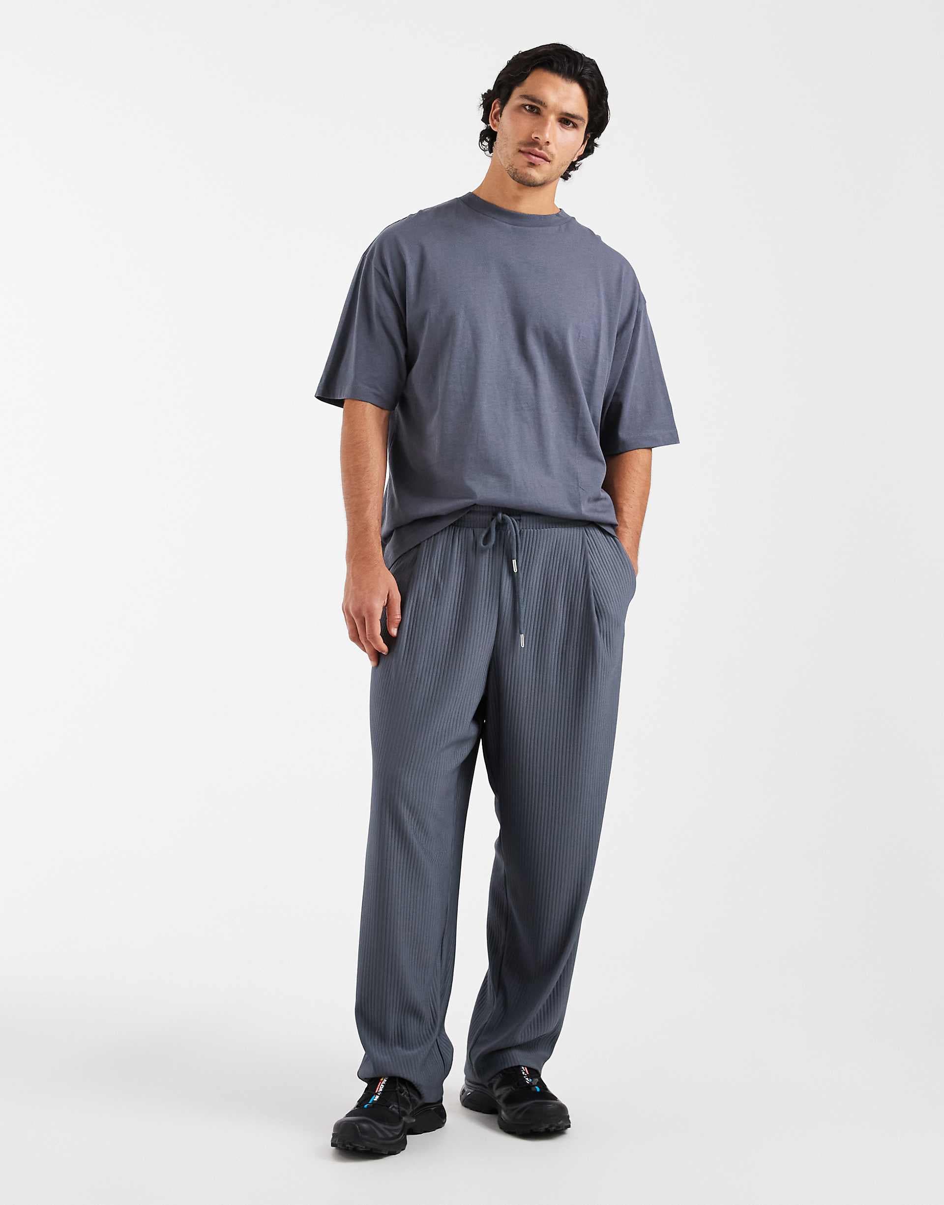 ASOS DESIGN relaxed taper pleated sweatpants in blue