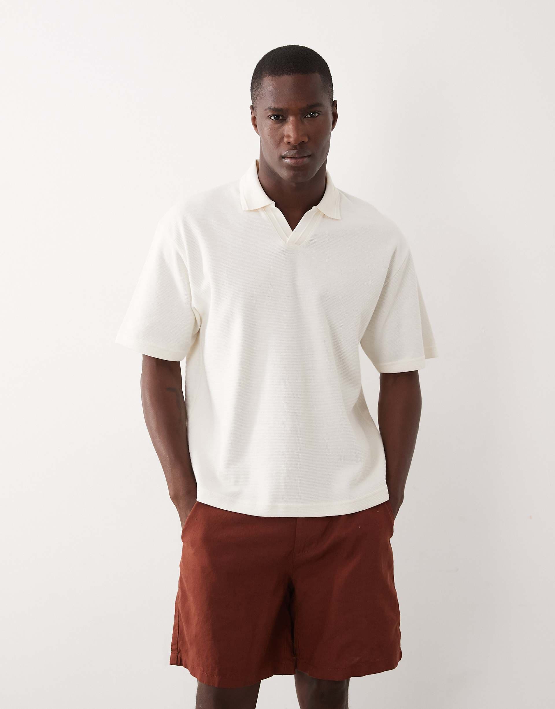 ASOS DESIGN relaxed boxy oversized notch polo with hem band in cream texture