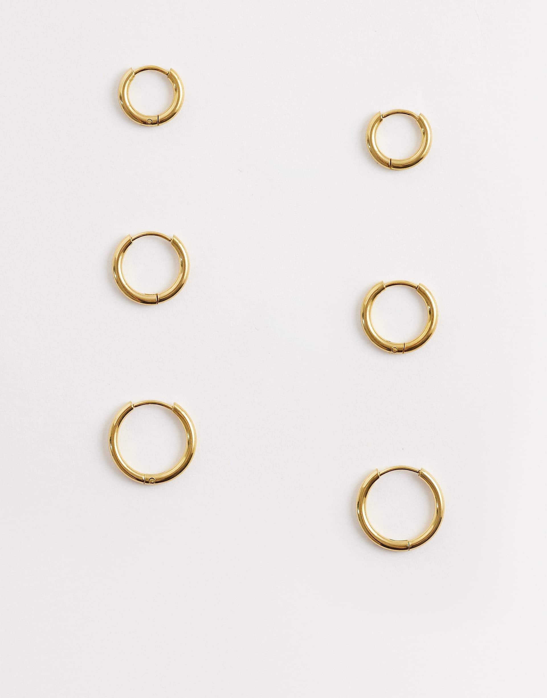 ASOS DESIGN pack of 3 waterproof stainless steel hoop earrings of graduated sizes in gold tone
