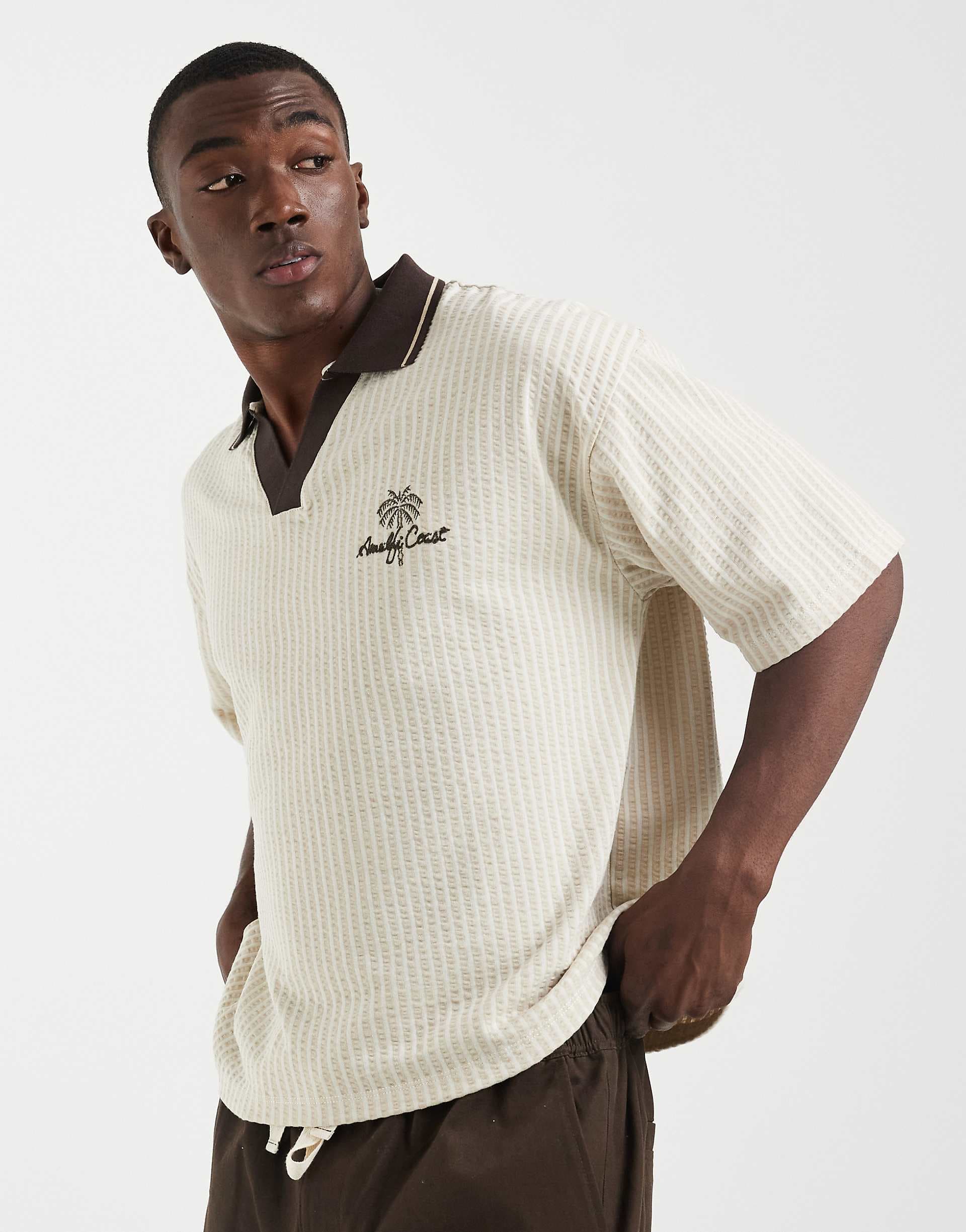 ASOS DESIGN boxy oversized polo with chest embroidery in cream texture
