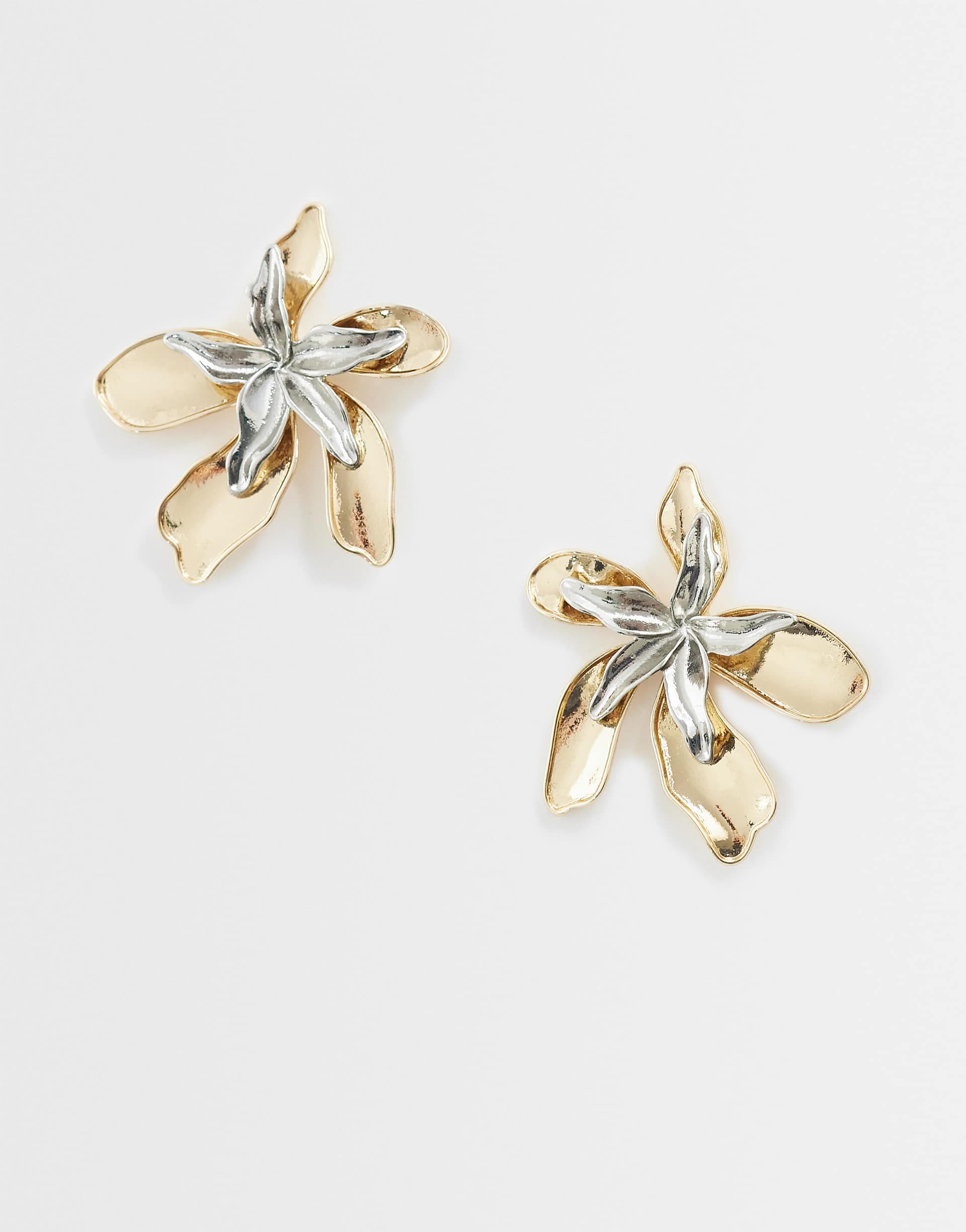 ASOS DESIGN large stud earrings with double flower overlay in gold and silver tone
