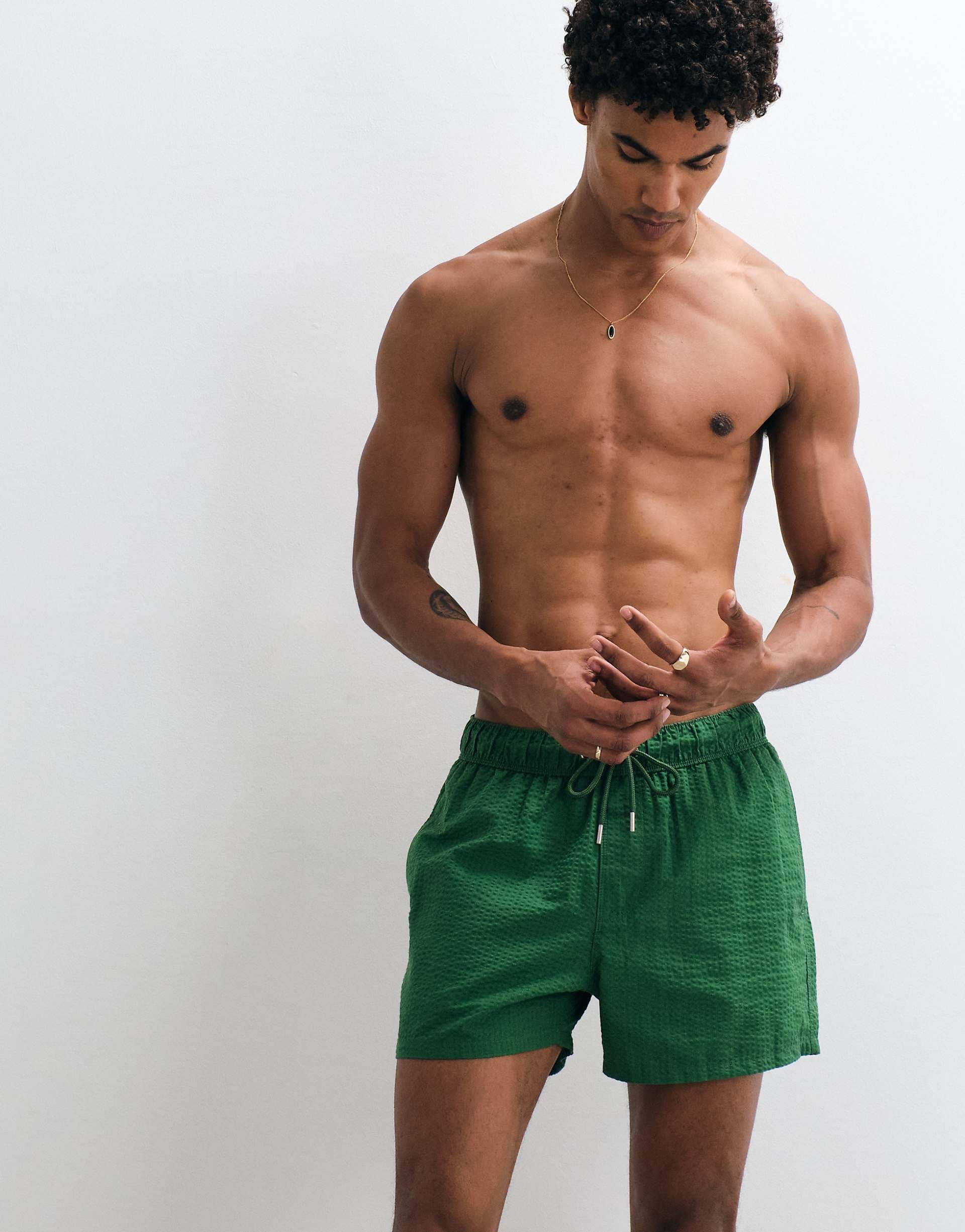 ASOS DESIGN seersucker swim shorts in short length in green