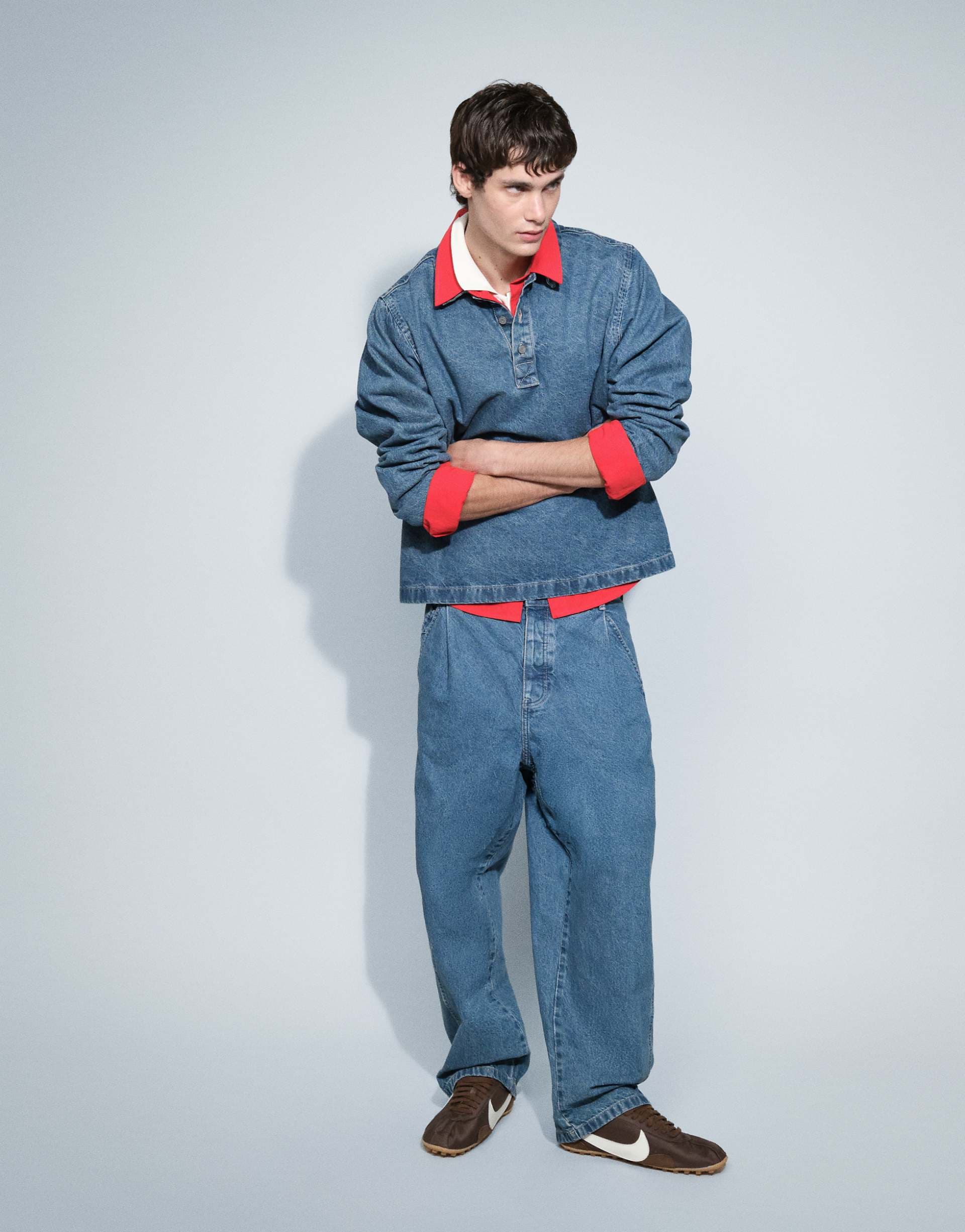 ASOS DESIGN relaxed tapered jeans in mid wash blue with pleats and buckle