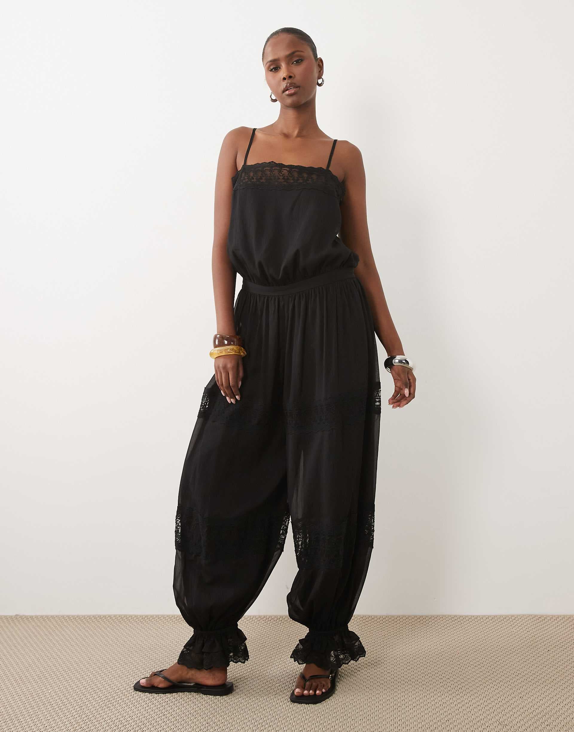 ASOS DESIGN sheer lace jumpsuit with bubble hem in black