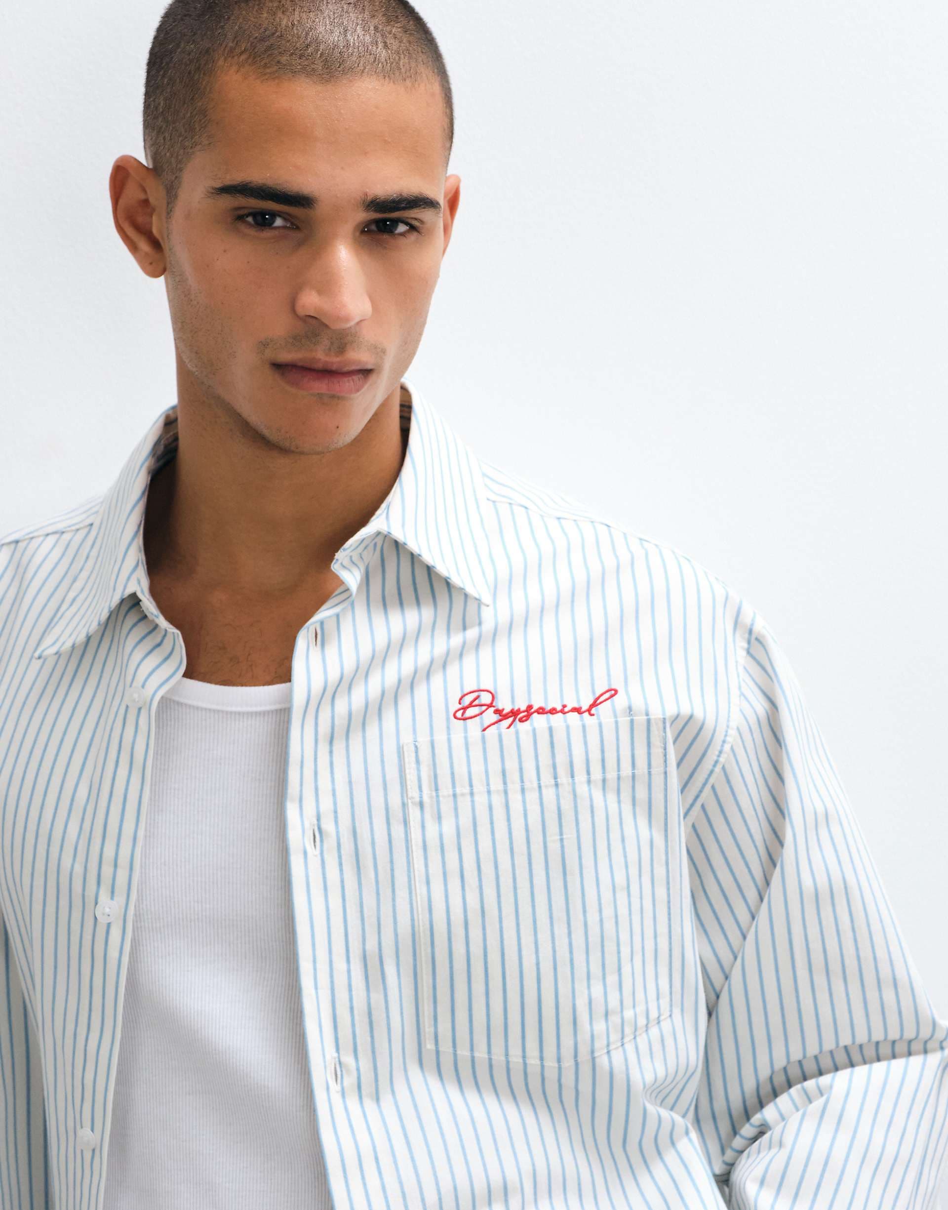ASOS DESIGN boxy oversized striped shirt with chest embroidery in blue and white