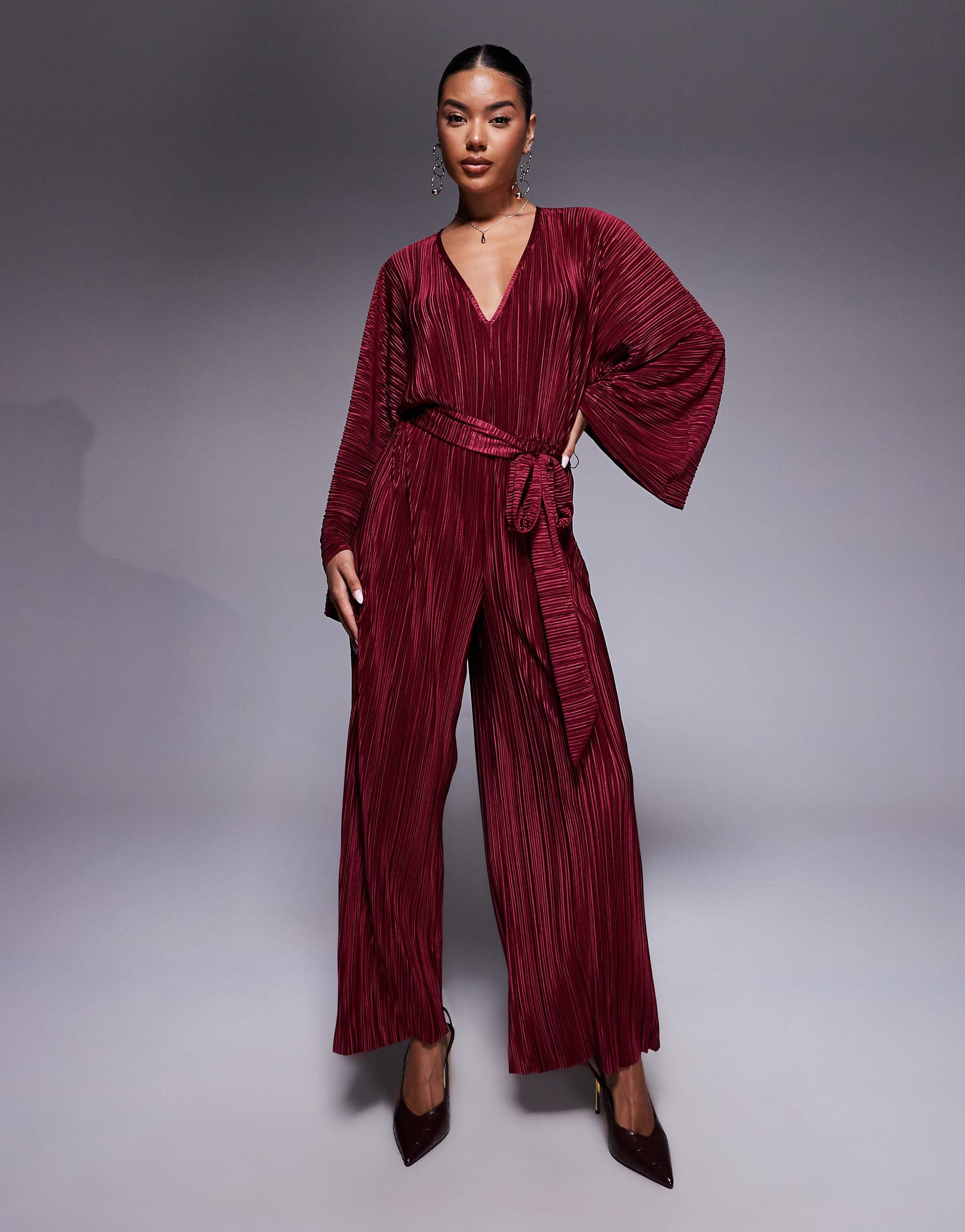 ASOS DESIGN plisse V front tie back waist wide leg jumpsuit in wine