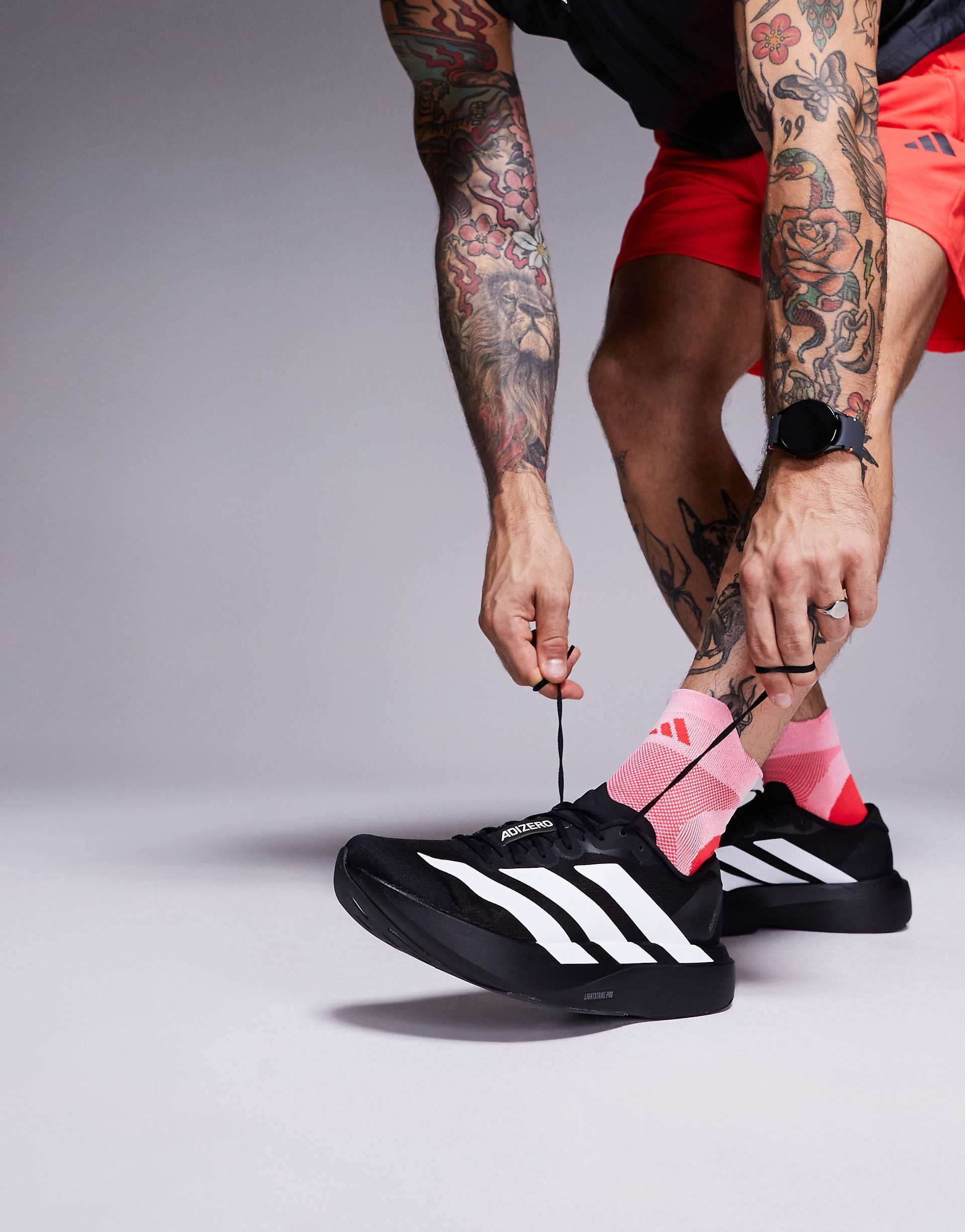 adidas Running Adizero Evo SL sneakers in black and white