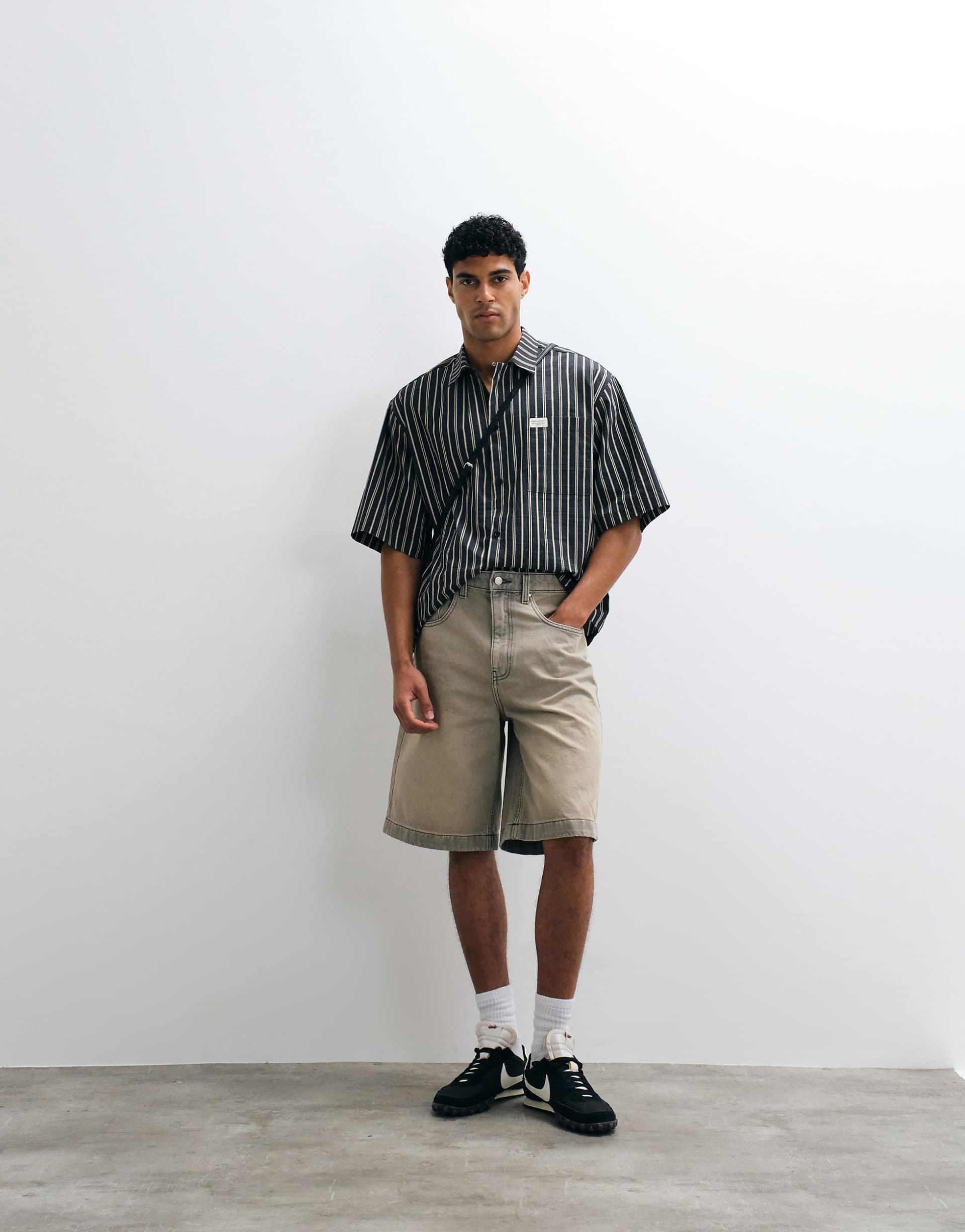 ASOS DESIGN oversized striped shirt with placket detail and badge in black