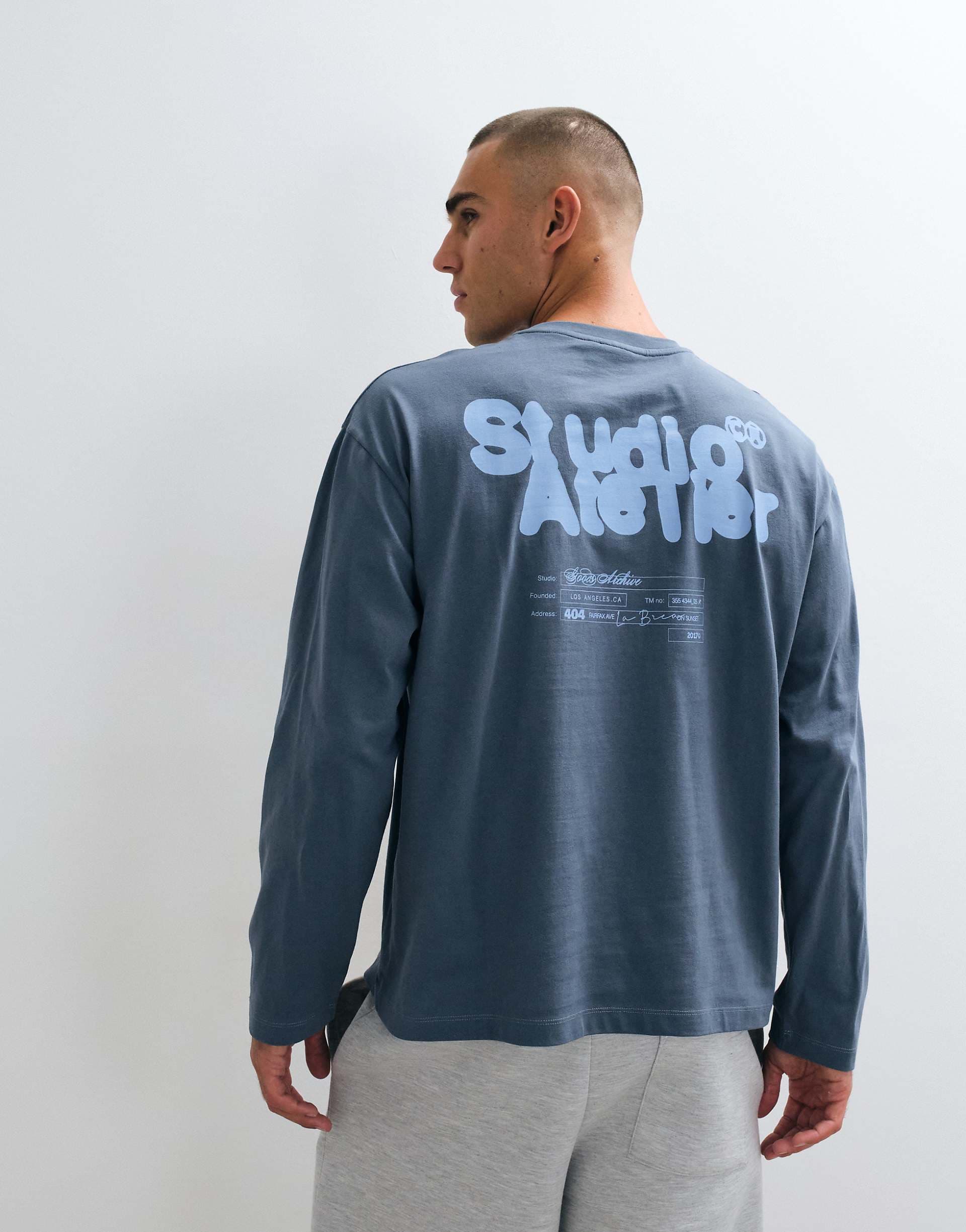 ASOS DESIGN oversized long sleeve t-shirt with text graphic in dark blue