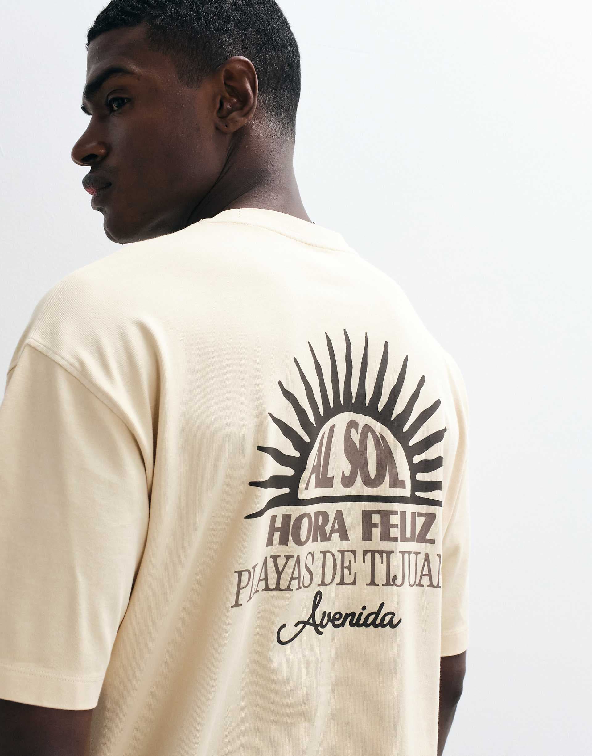 ASOS DESIGN heavyweight oversized T-shirt with sun graphic in yellow wash