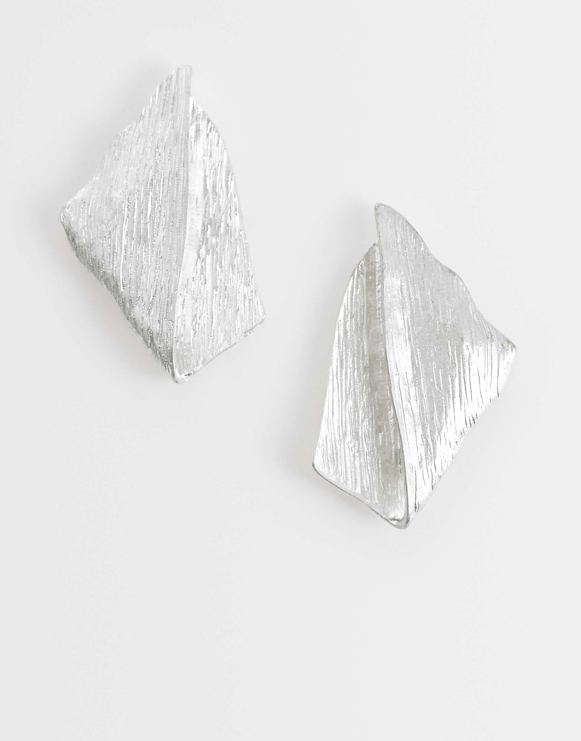 ASOS DESIGN large stud earrings with fold-over diamond design in brushed silver