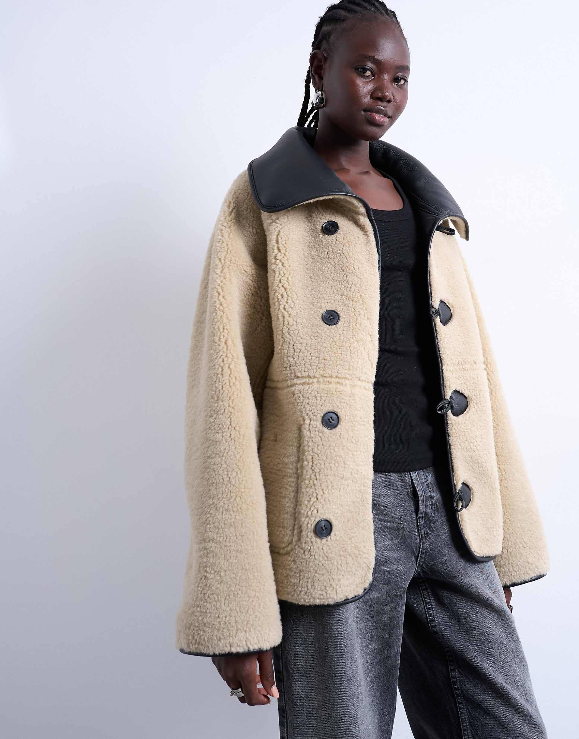 Topshop faux shearling oversized reversible coat with button loops in black and cream